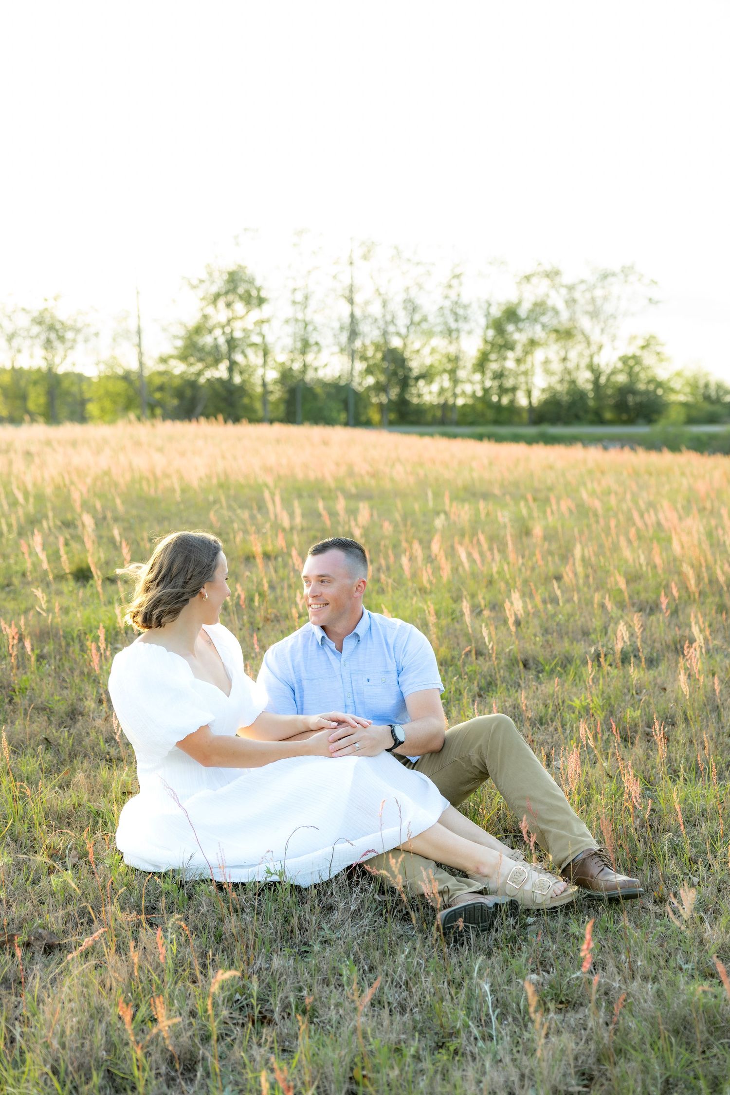 Storytelling couple photos in a tall grass field at sunset in Dothan, Alabama
