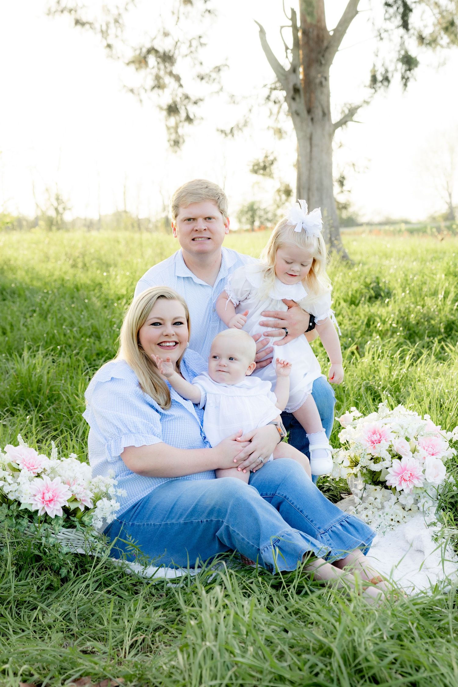 Spring Mini Session with baby chicks in a grass field at sunset near Dothan, Alabama