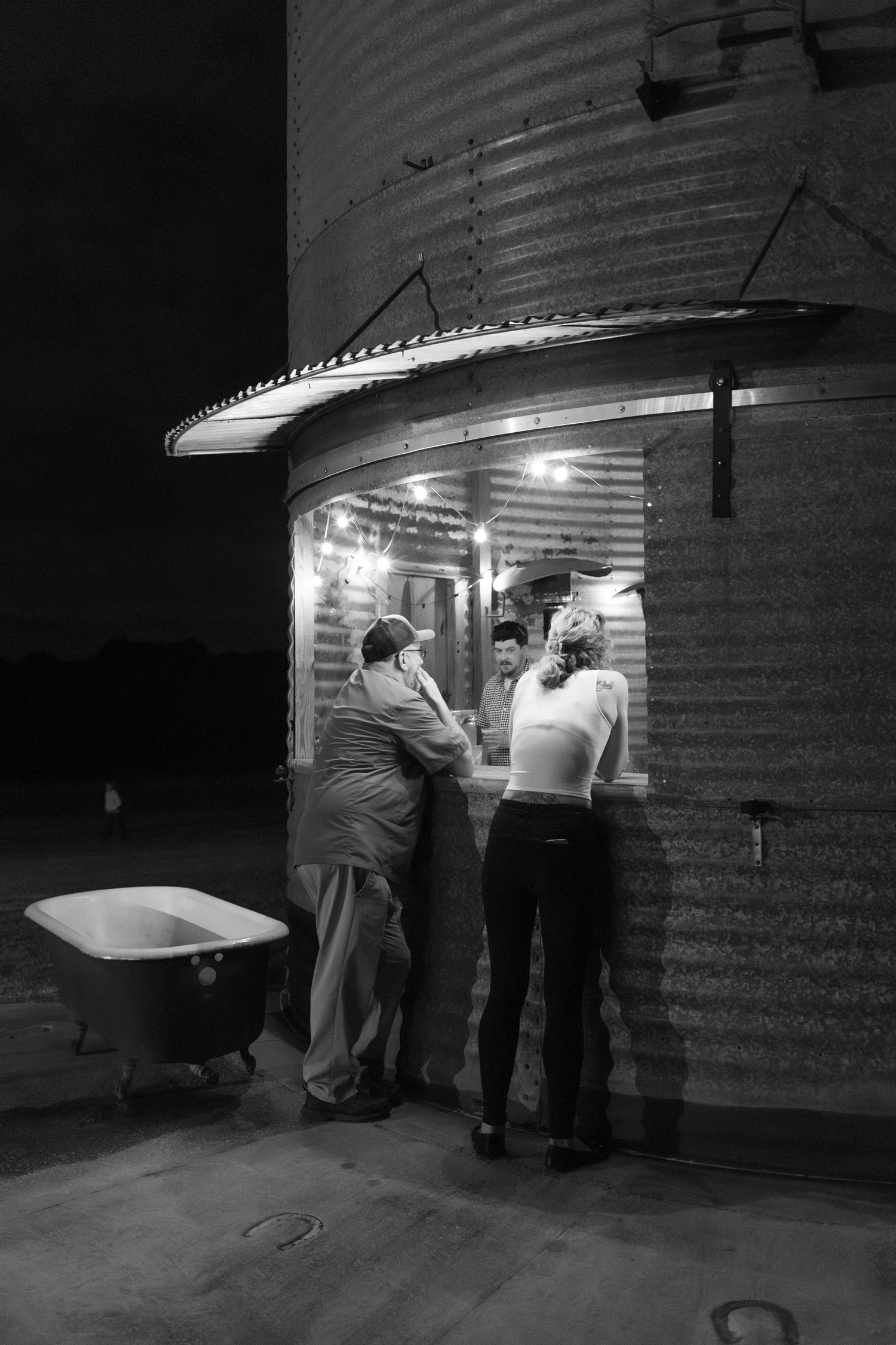 Guests mingle at the bar at Hilltop Acres Wicksburg, Alabama
