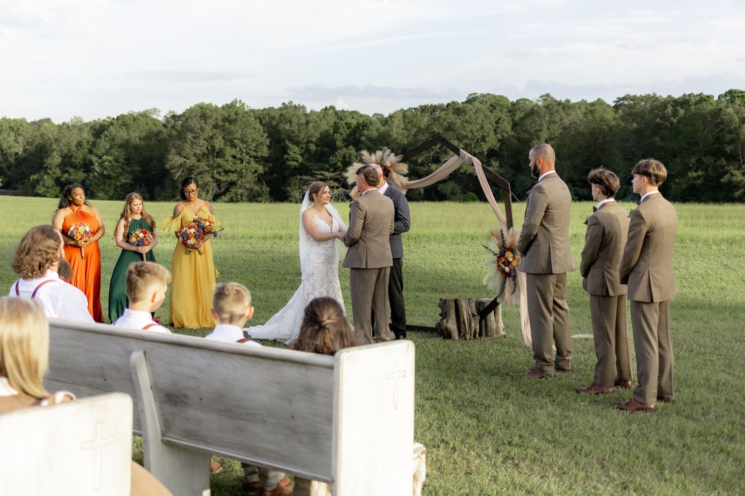 Bride and groom at the altar at their wedding at Hilltop Acres Wicksburg, Alabama