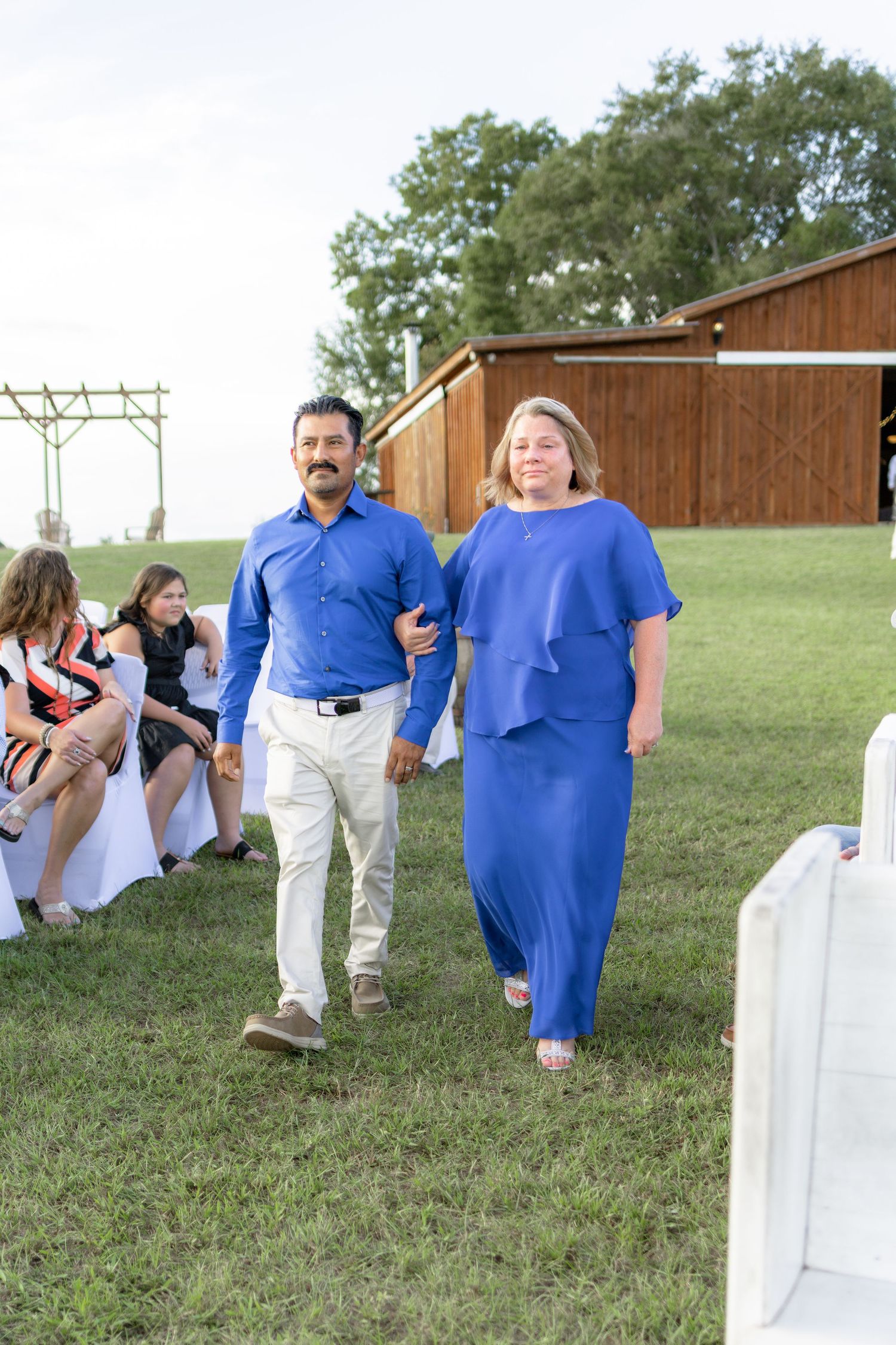 Bridal party walking down the aisle of a wedding at Hilltop Acres Wicksburg, Alabama