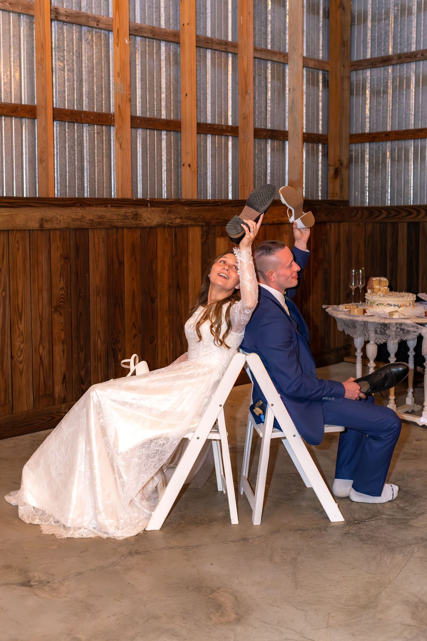 Bride and groom play the shoe game at their reception at Dalrymple Farms Enterprise, Alabama
