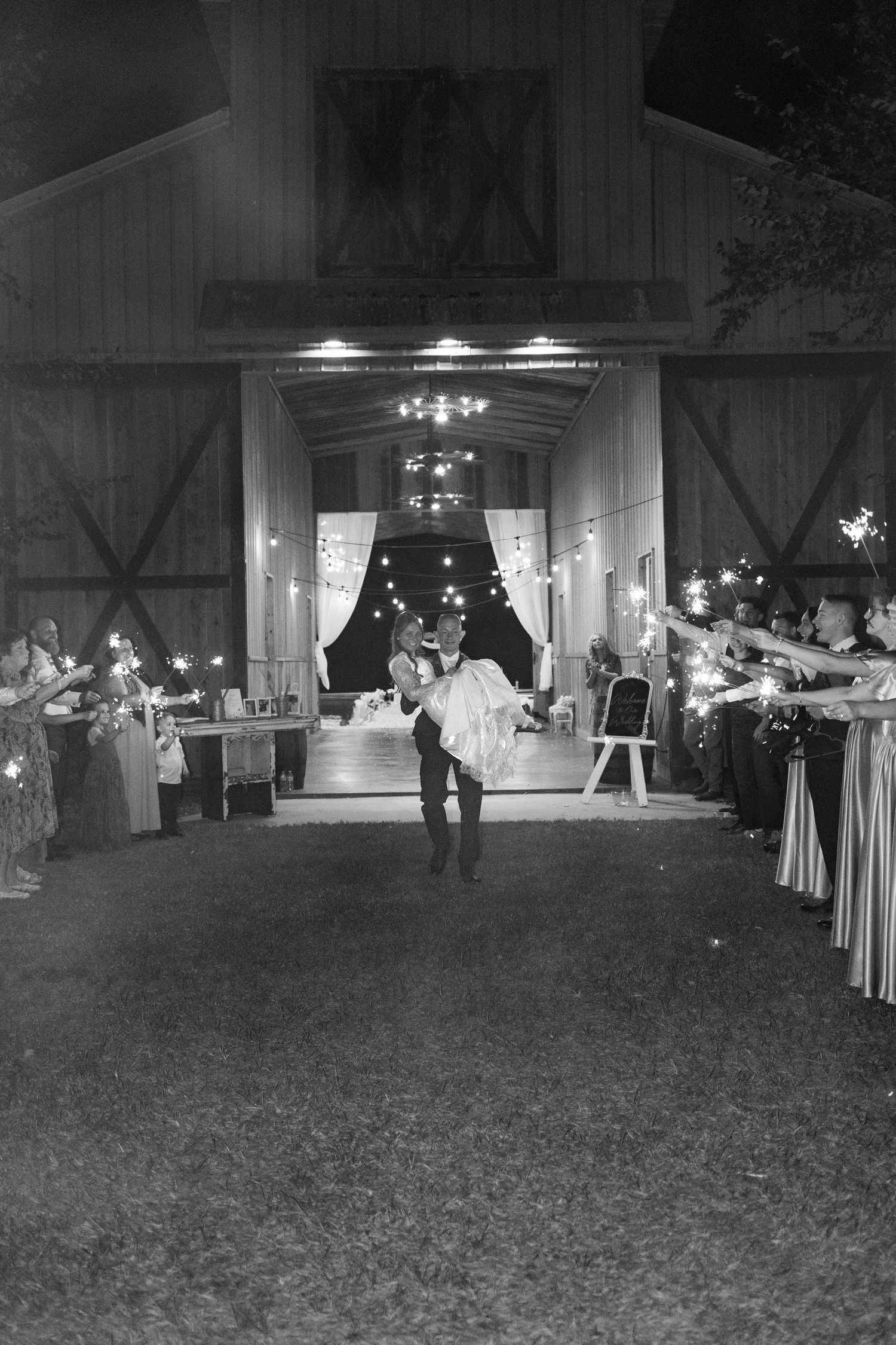 Bride and groom running through a sparkler exit at Dalrymple Farms Enterprise, Alabama