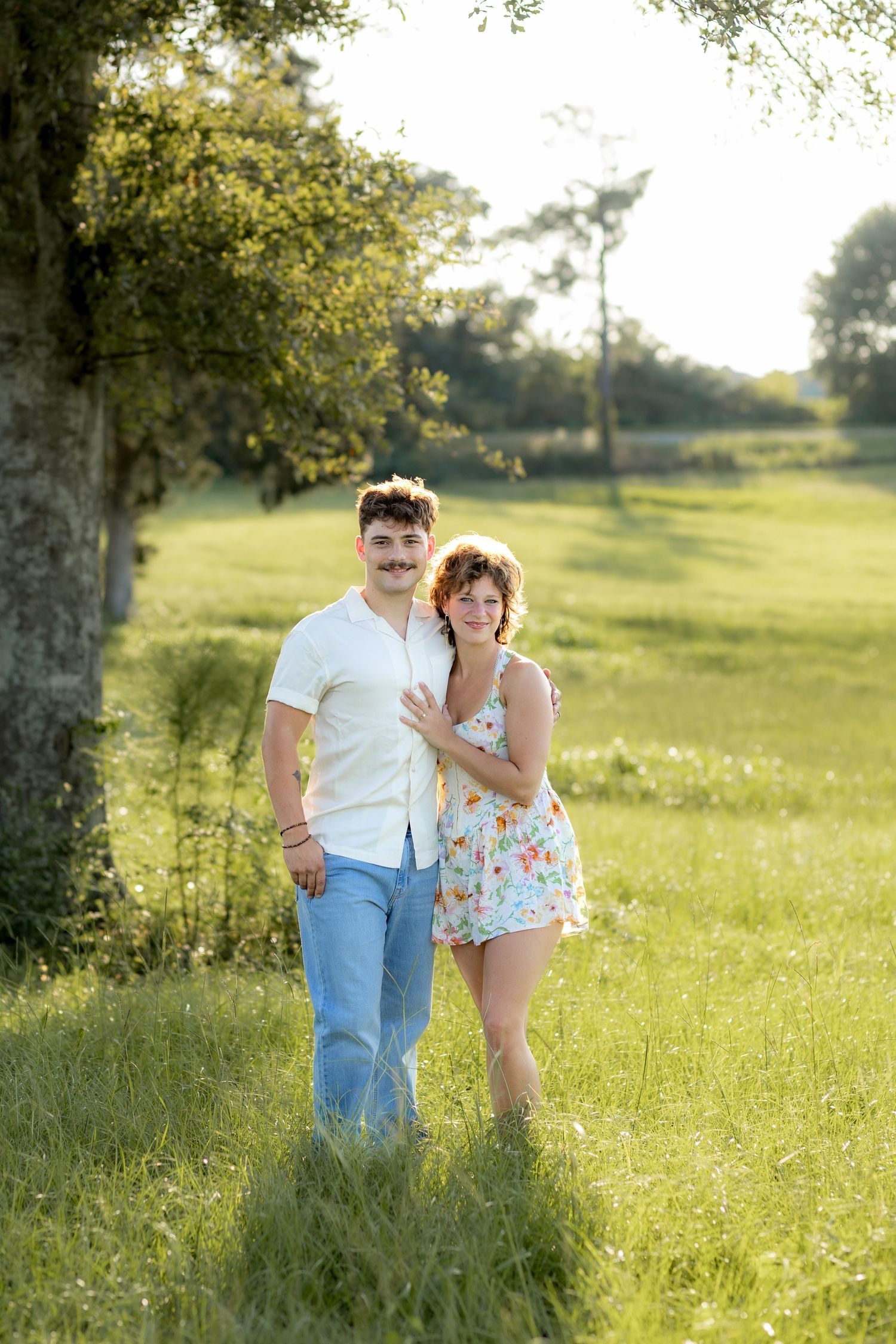 Romantic Couples photos in a tall grass field at sunset near Dothan, Alabama