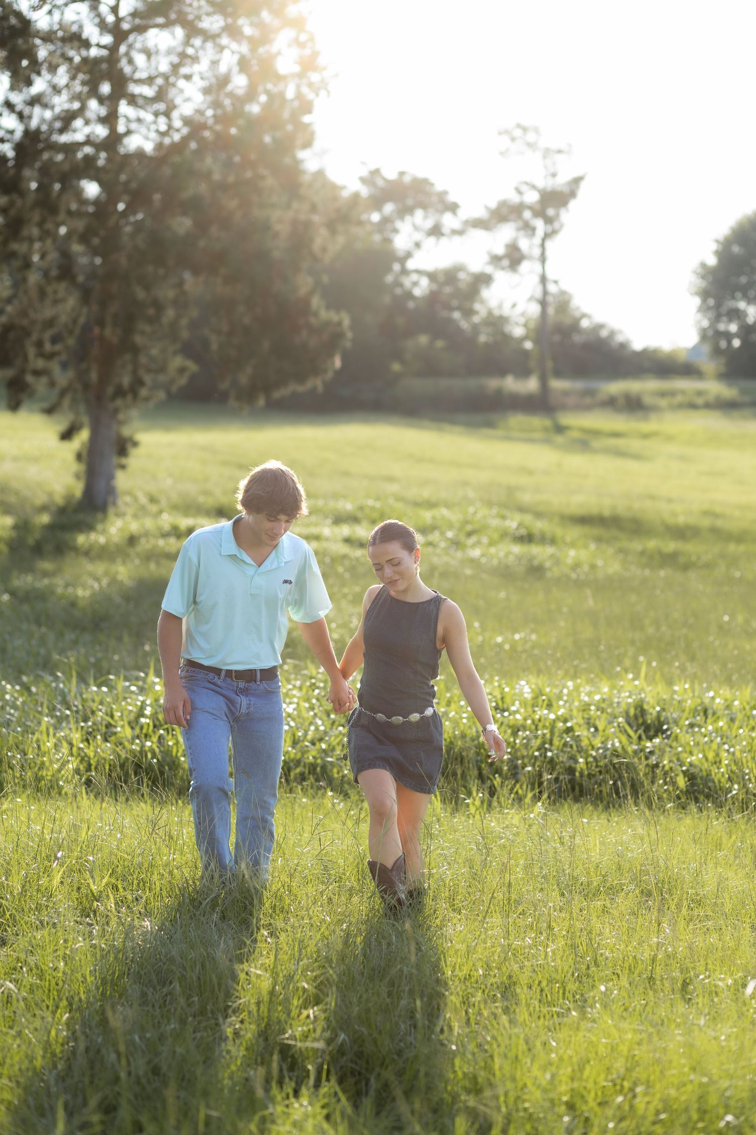 Romantic Couples photos in a tall grass field at sunset near Dothan, Alabama