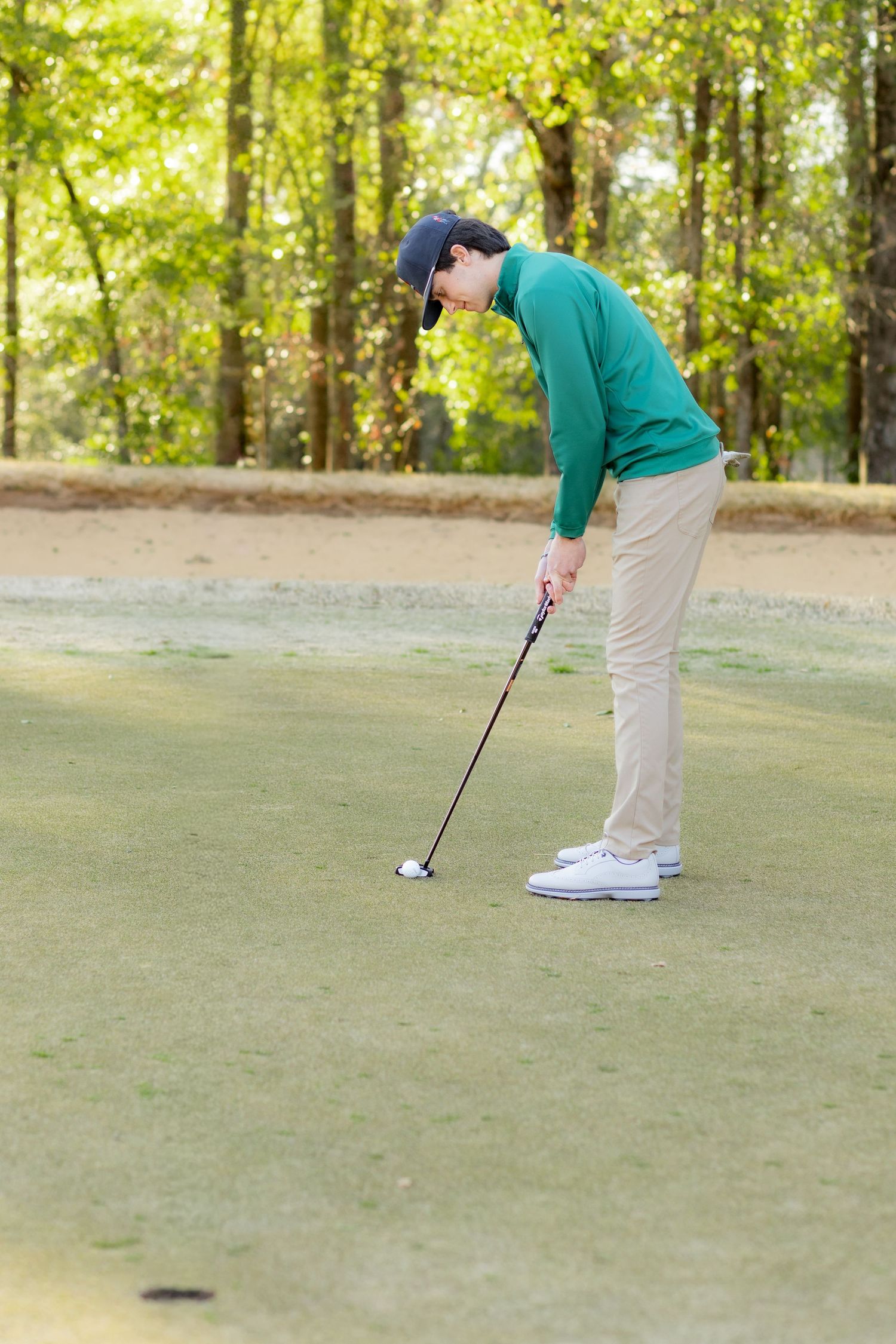 Senior playing golf on a golf course in Enterprise, Alabama