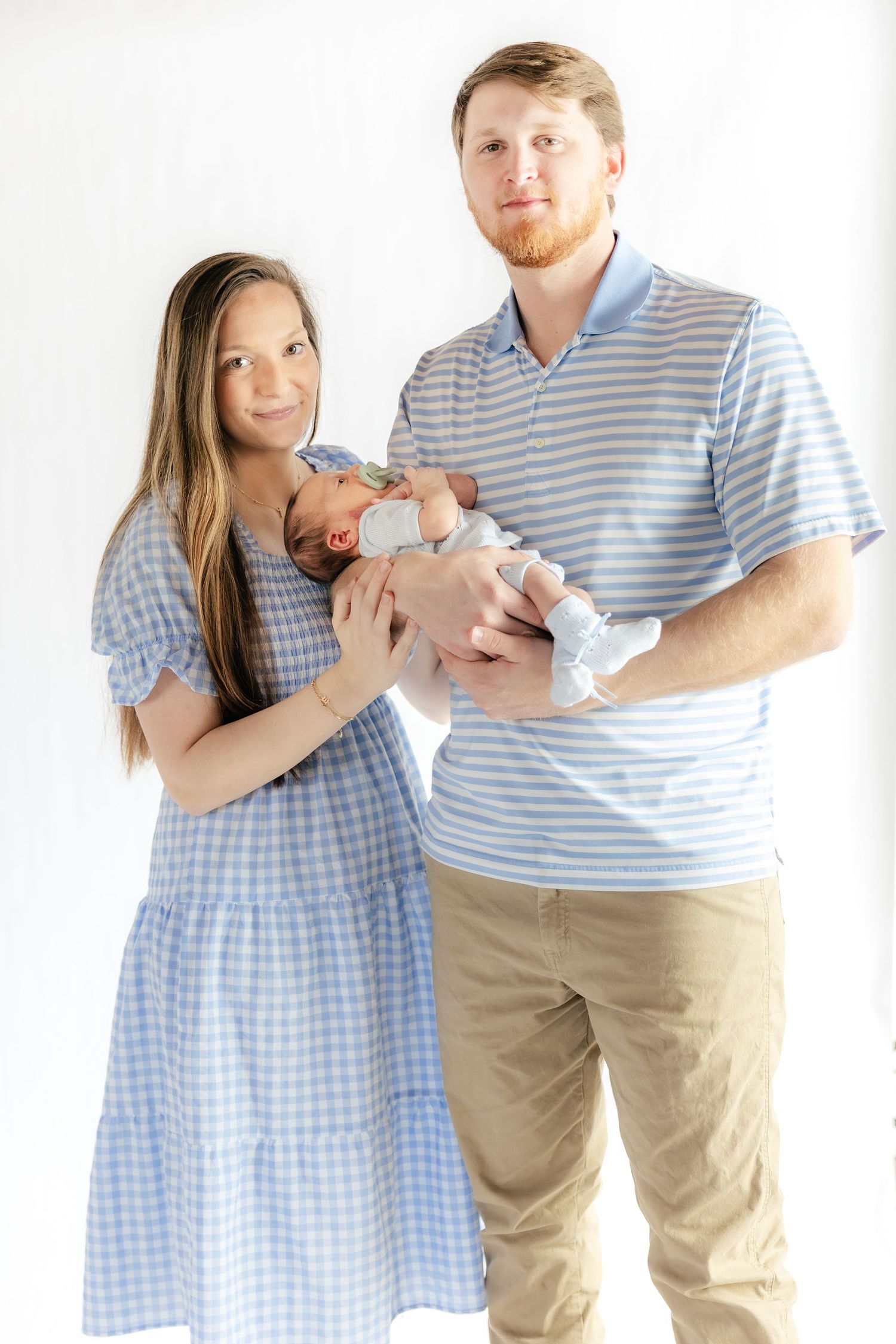 Family holding their baby in a studio in Dothan, Alabama