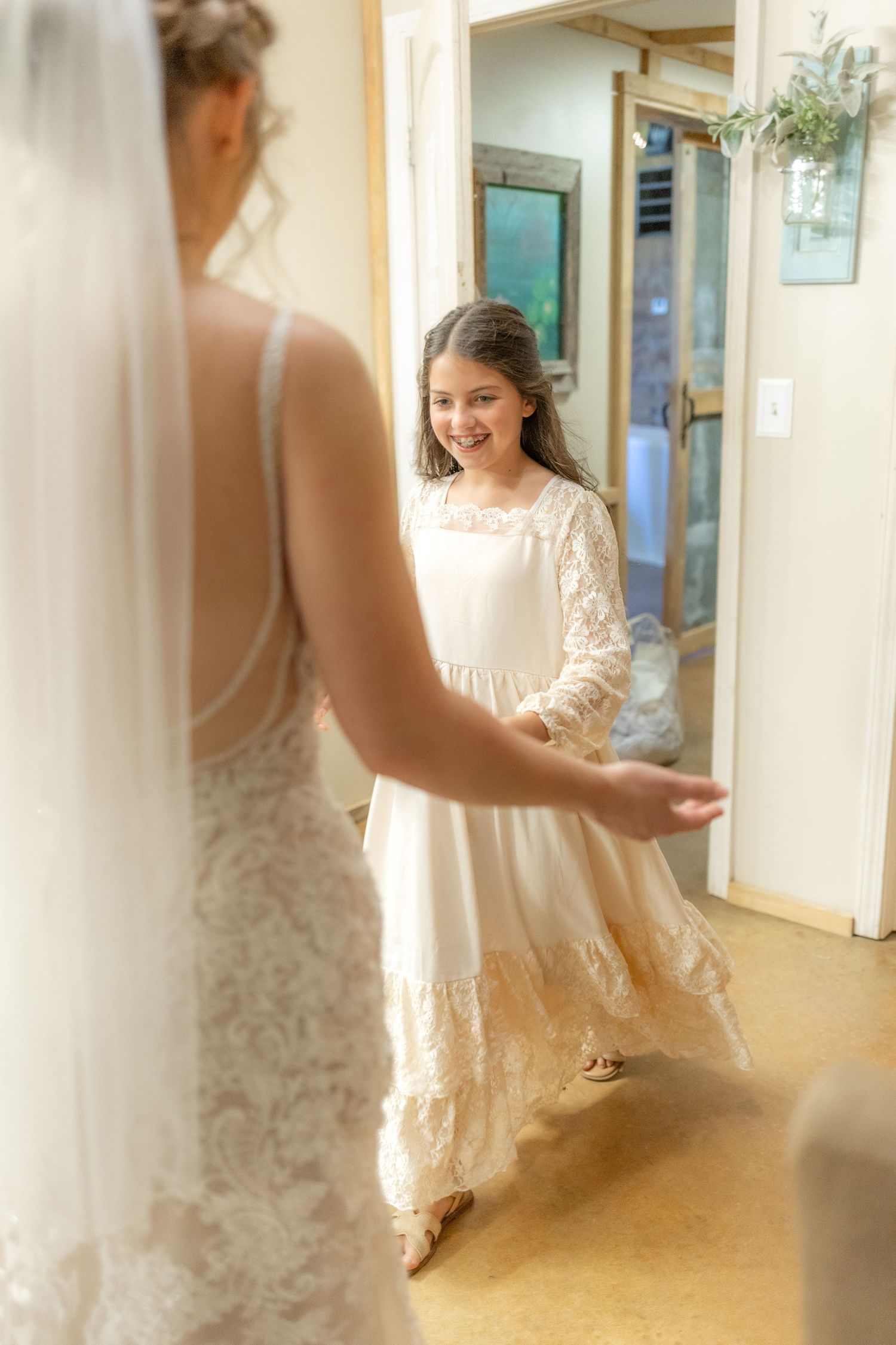 Daughter emotional first look with bride on her wedding day at Hilltop Acres Wicksburg, Alabama