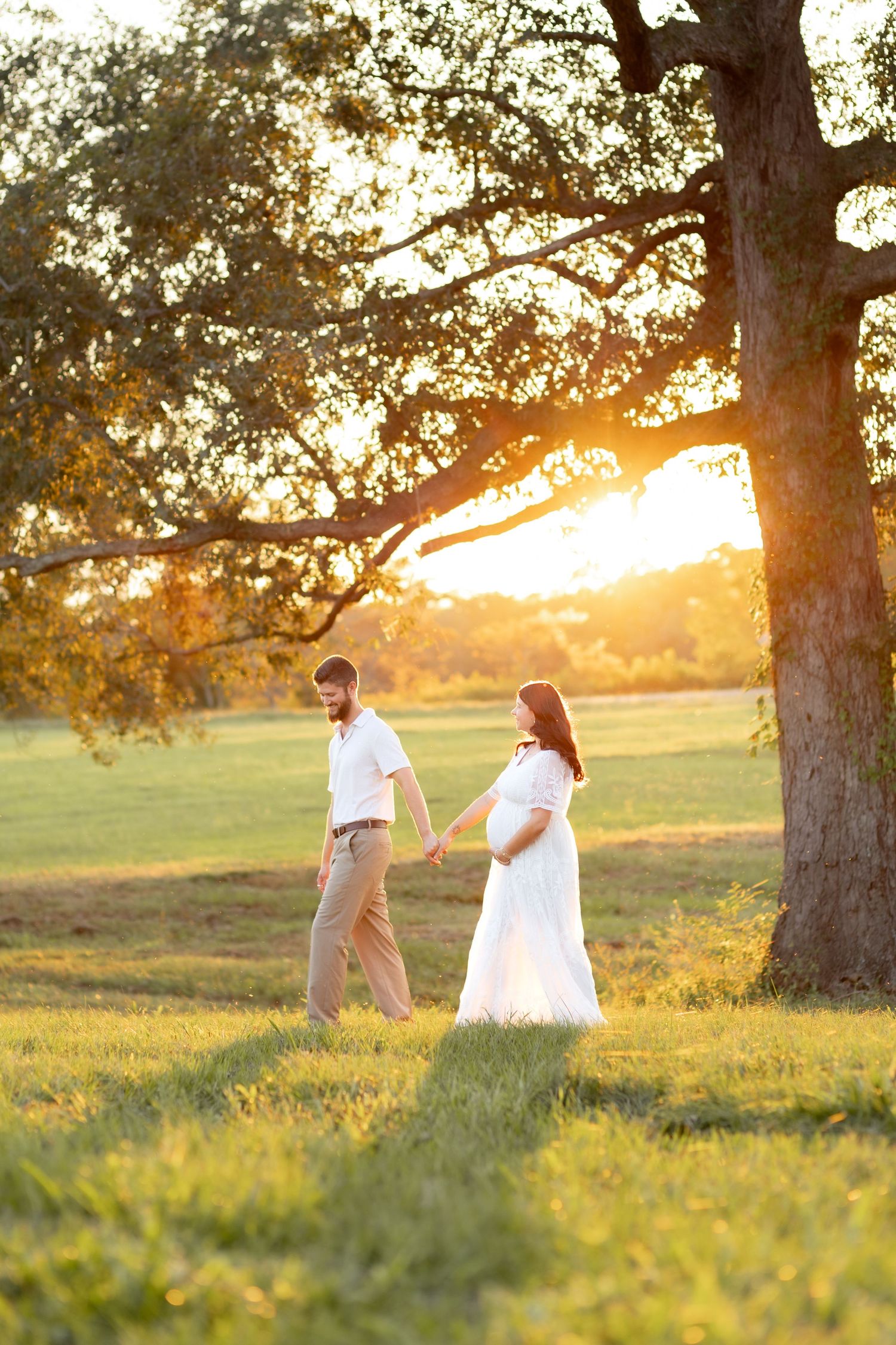 Couple Photos in a grass field at sunset near Dothan, Alabama