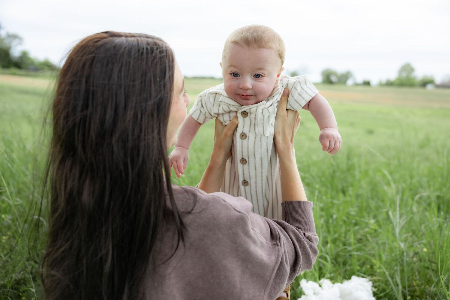 Candid family photos in a grass field | Dothan, Alabama Lifestyle Portrait Photographer