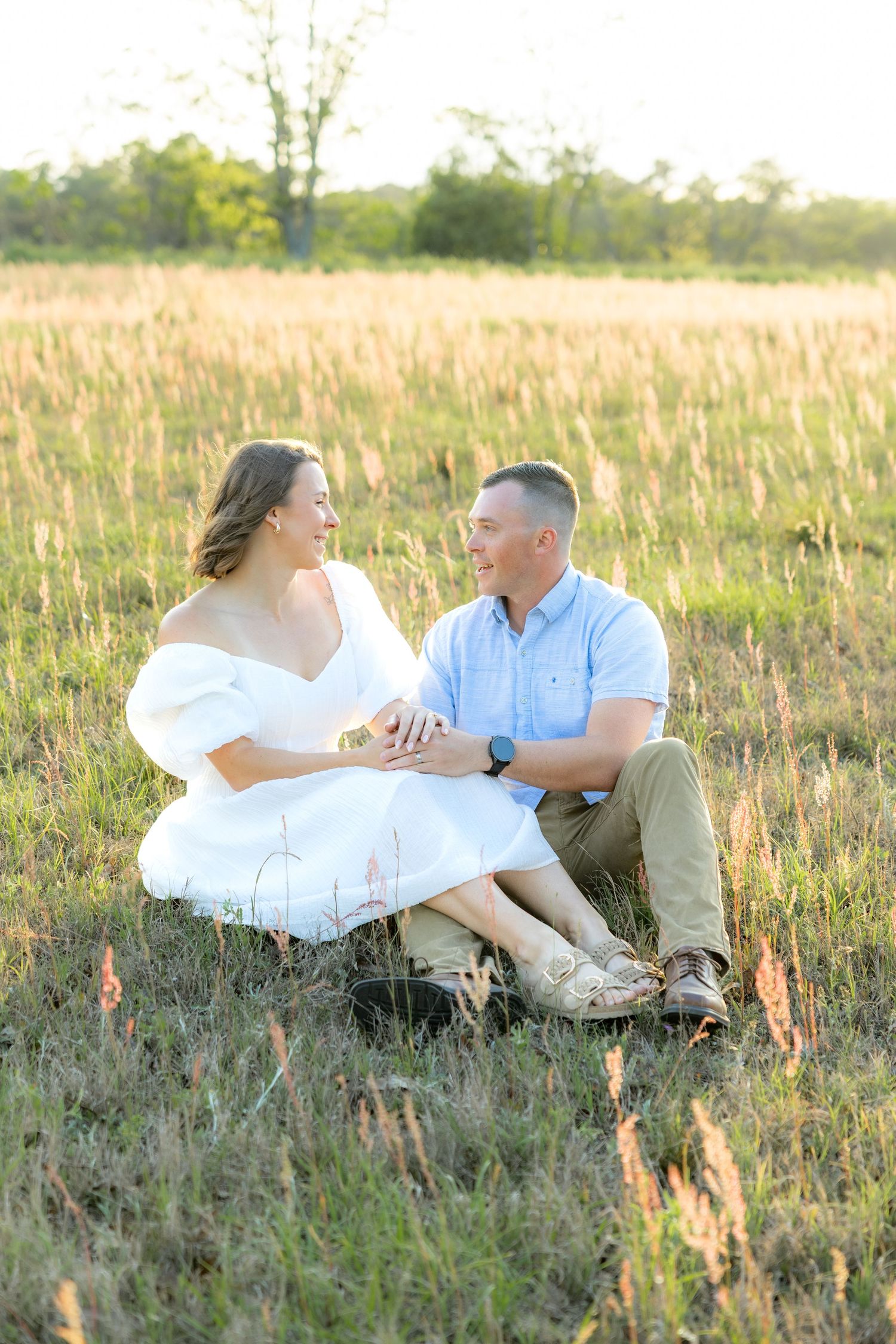 Storytelling couple photos in a tall grass field at sunset in Dothan, Alabama
