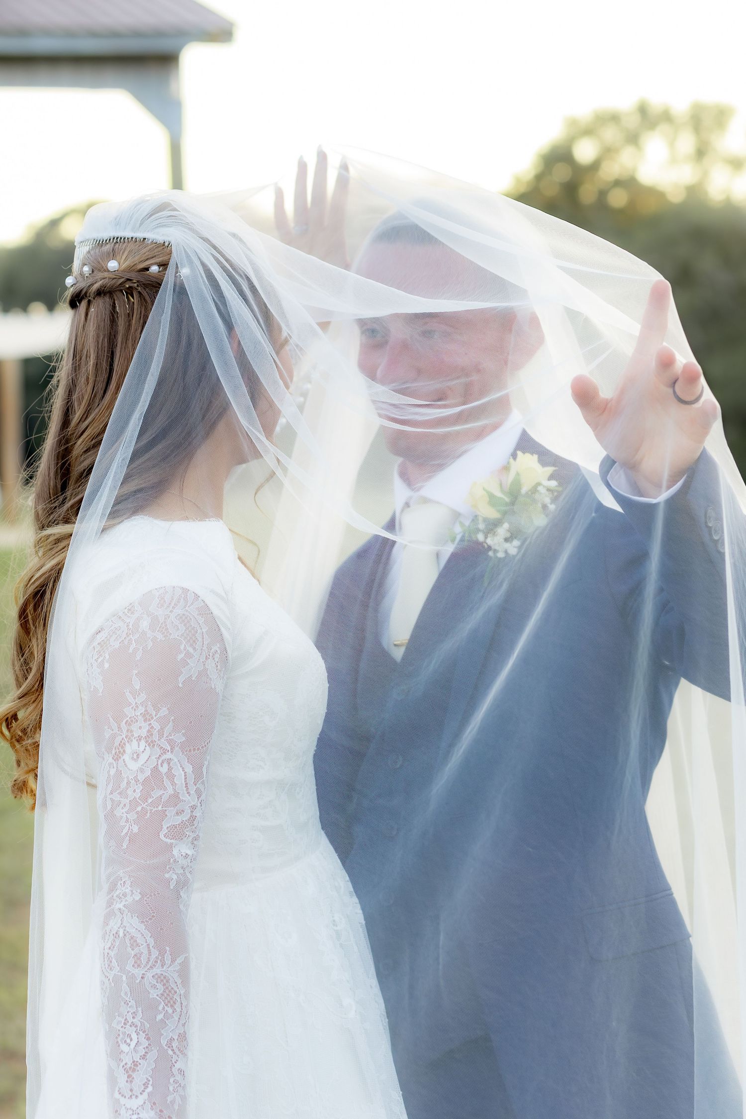 Bride and groom holding each other for portraits at Dalrymple Farms Enterprise, Alabama
