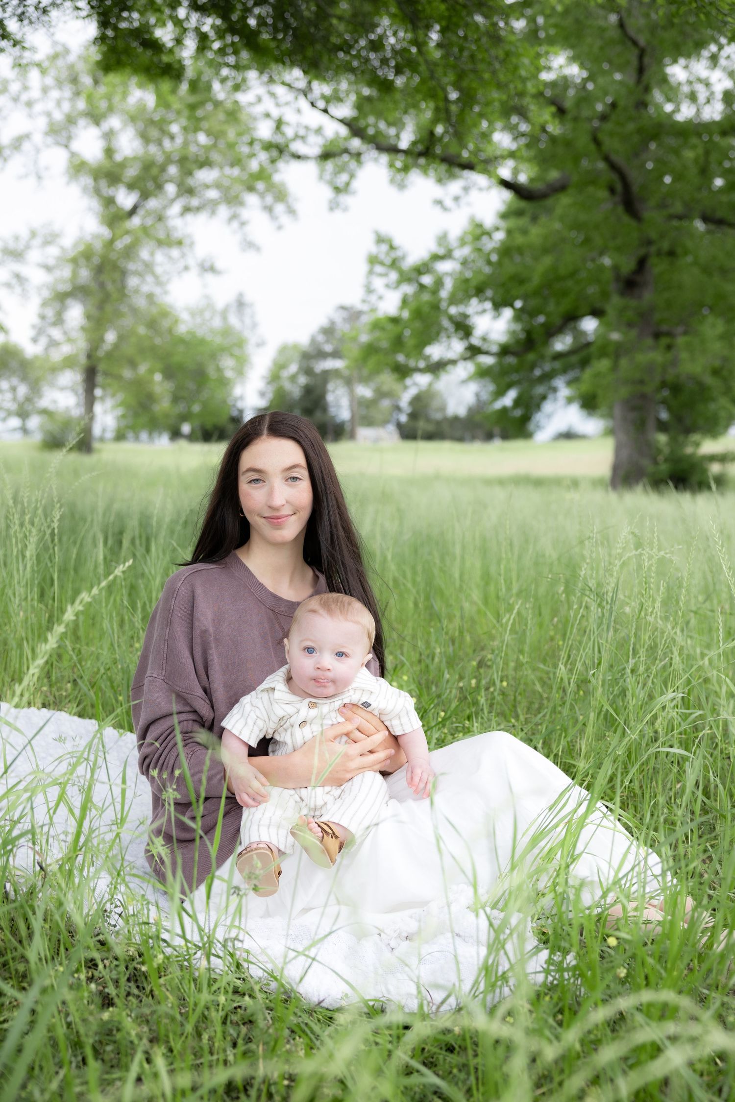 Candid family photos in a grass field | Dothan, Alabama Lifestyle Portrait Photographer