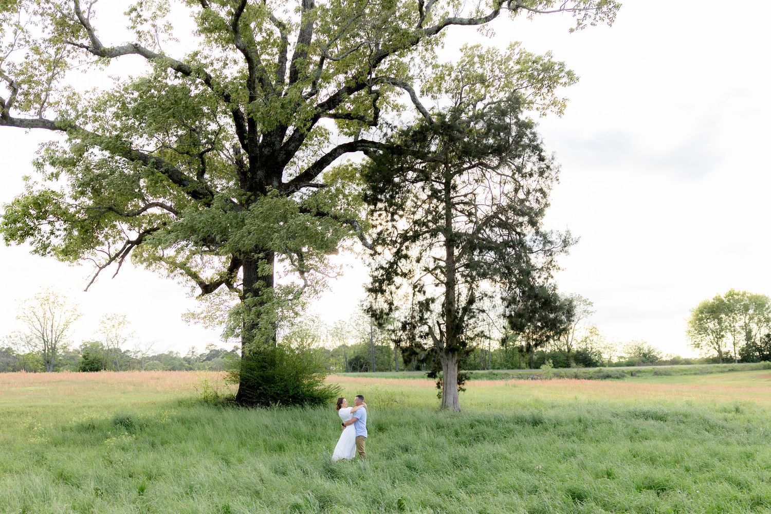 Storytelling romantic couple photos in a tall grass field at sunset in Dothan, Alabama