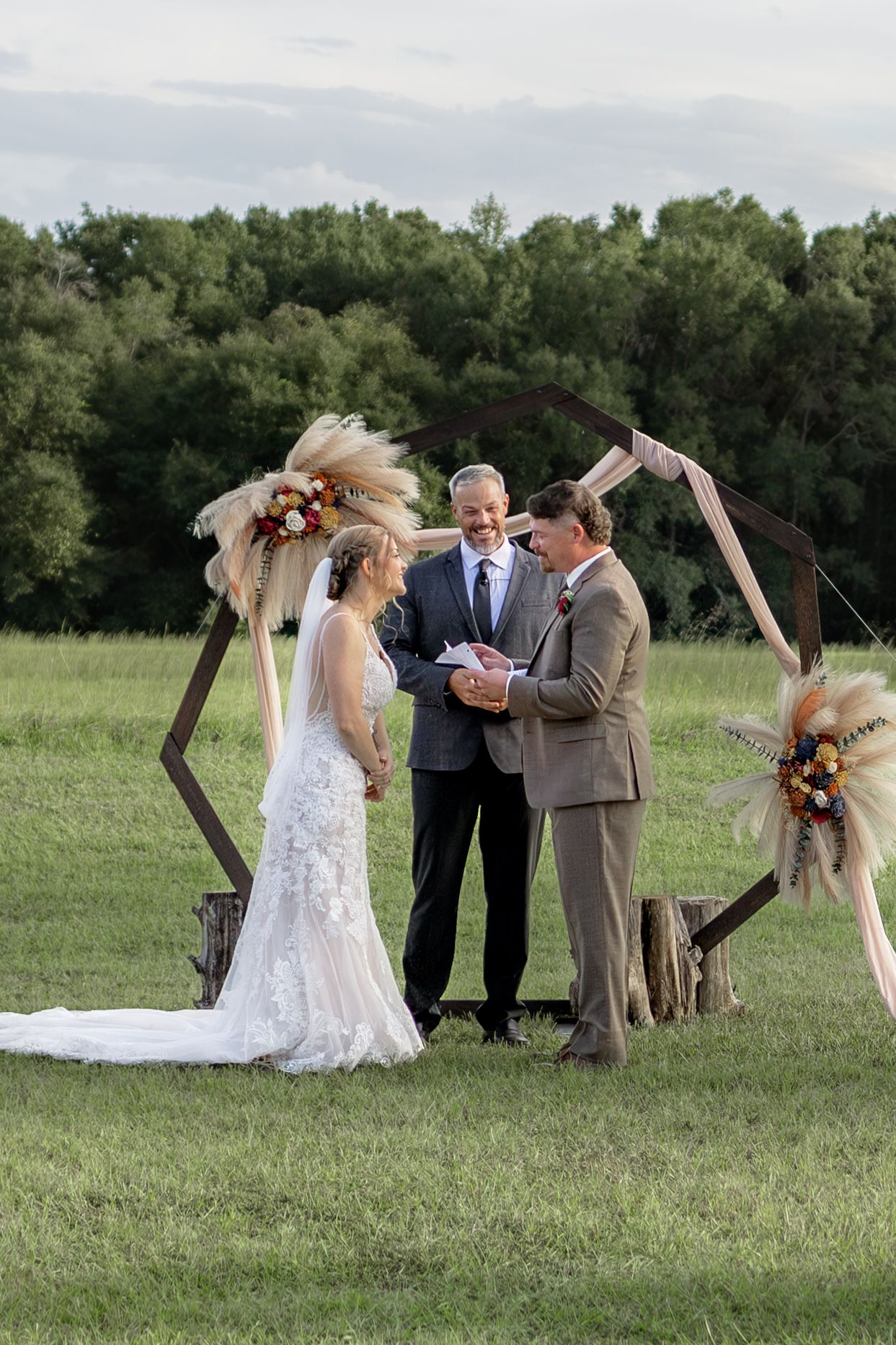 Bride and groom saying their vows at their wedding at Hilltop Acres Wicksburg, Alabama