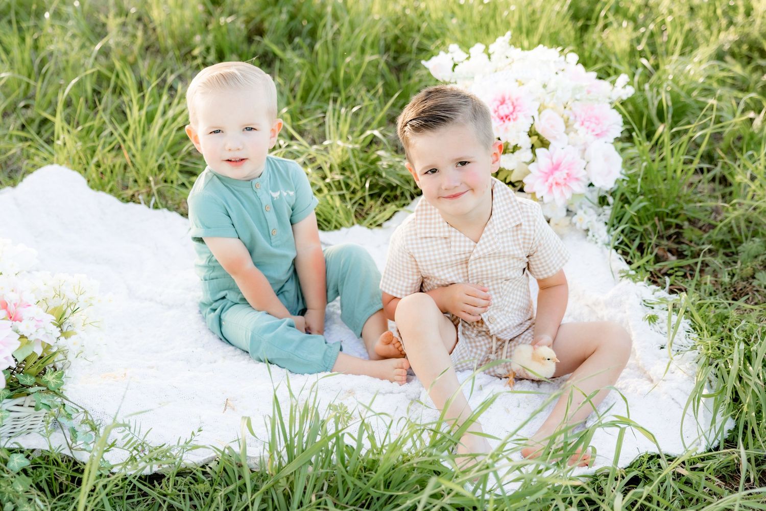 Spring Mini Session with baby chicks in a grass field at sunset near Dothan, Alabama