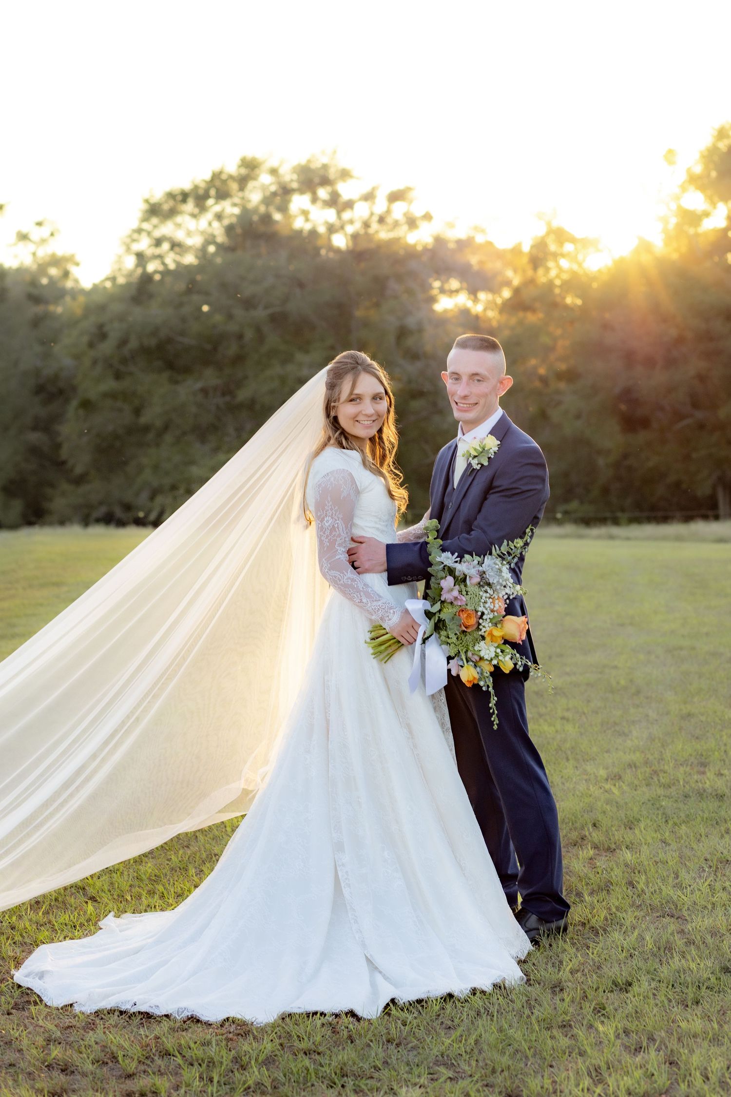 Bride and groom holding each other for portraits at Dalrymple Farms Enterprise, Alabama