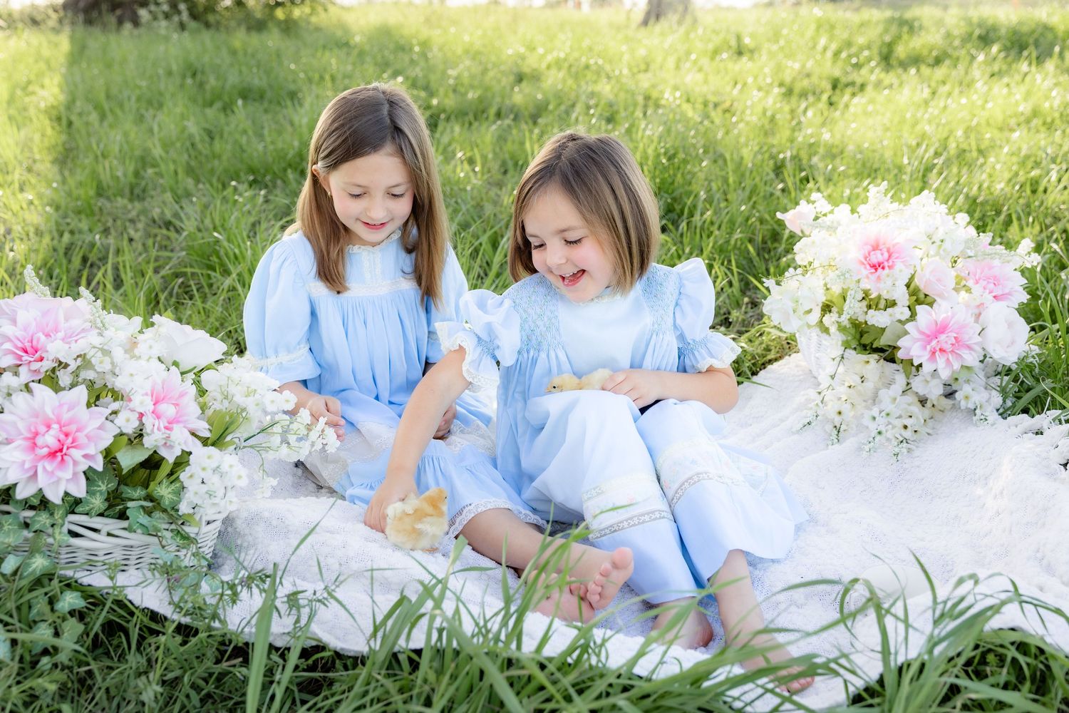 Spring Mini Session with baby chicks in a grass field at sunset near Dothan, Alabama