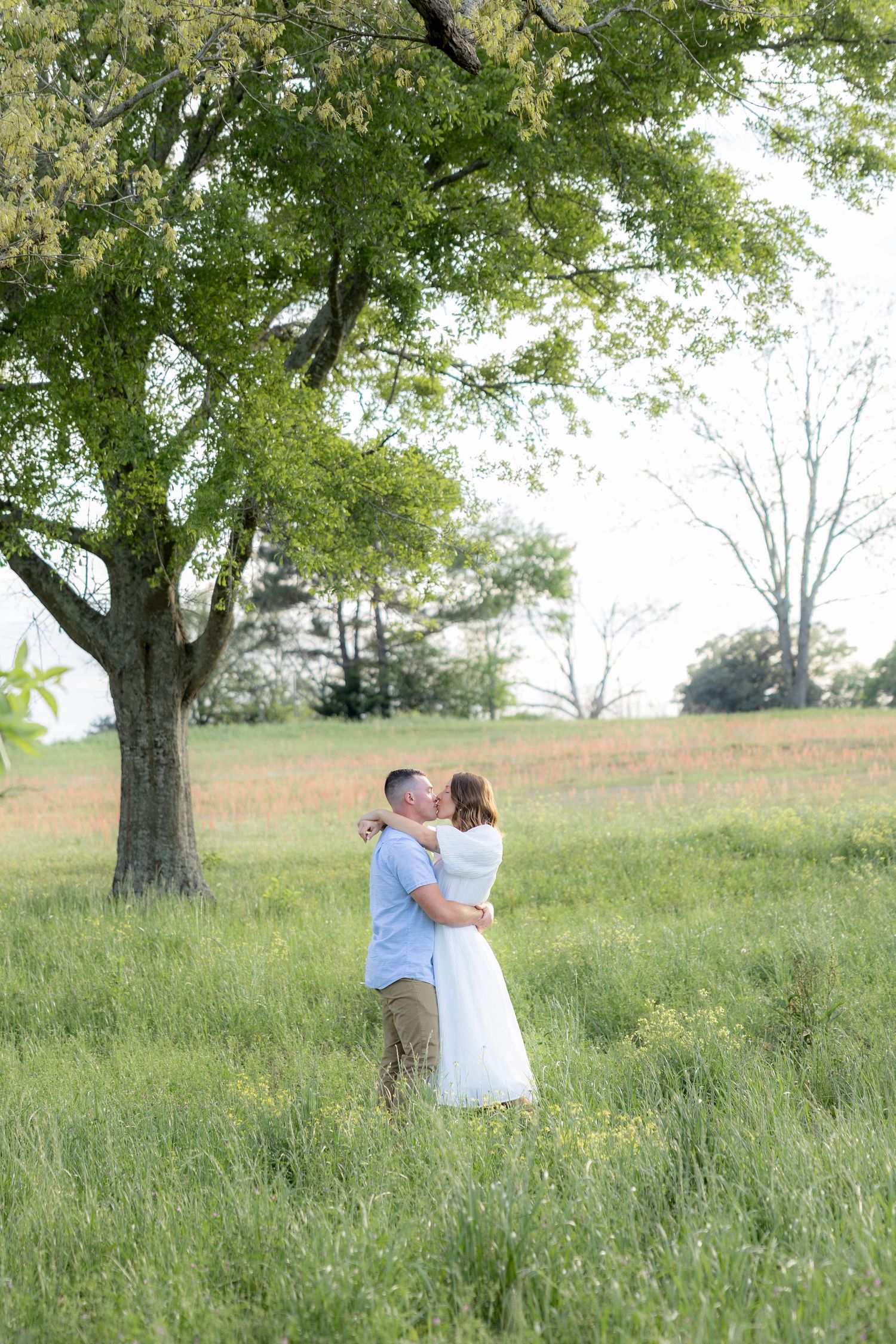 Storytelling romantic couple photos in a tall grass field at sunset in Dothan, Alabama