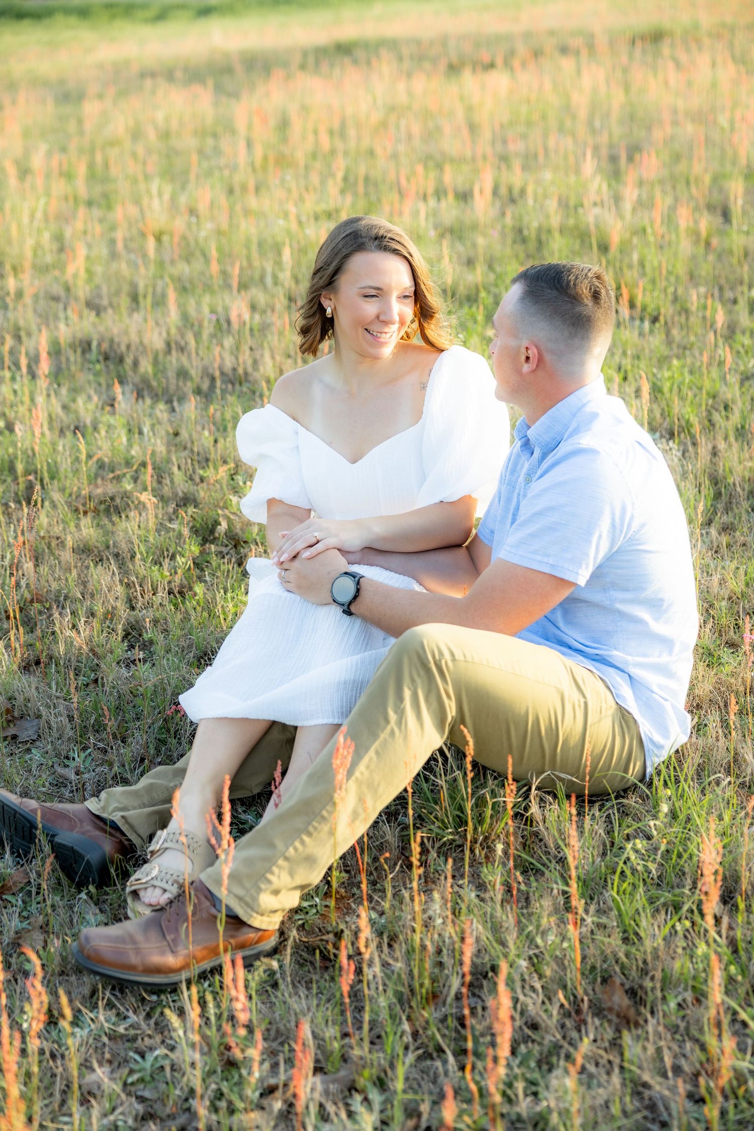 Storytelling couple photos in a tall grass field at sunset in Dothan, Alabama