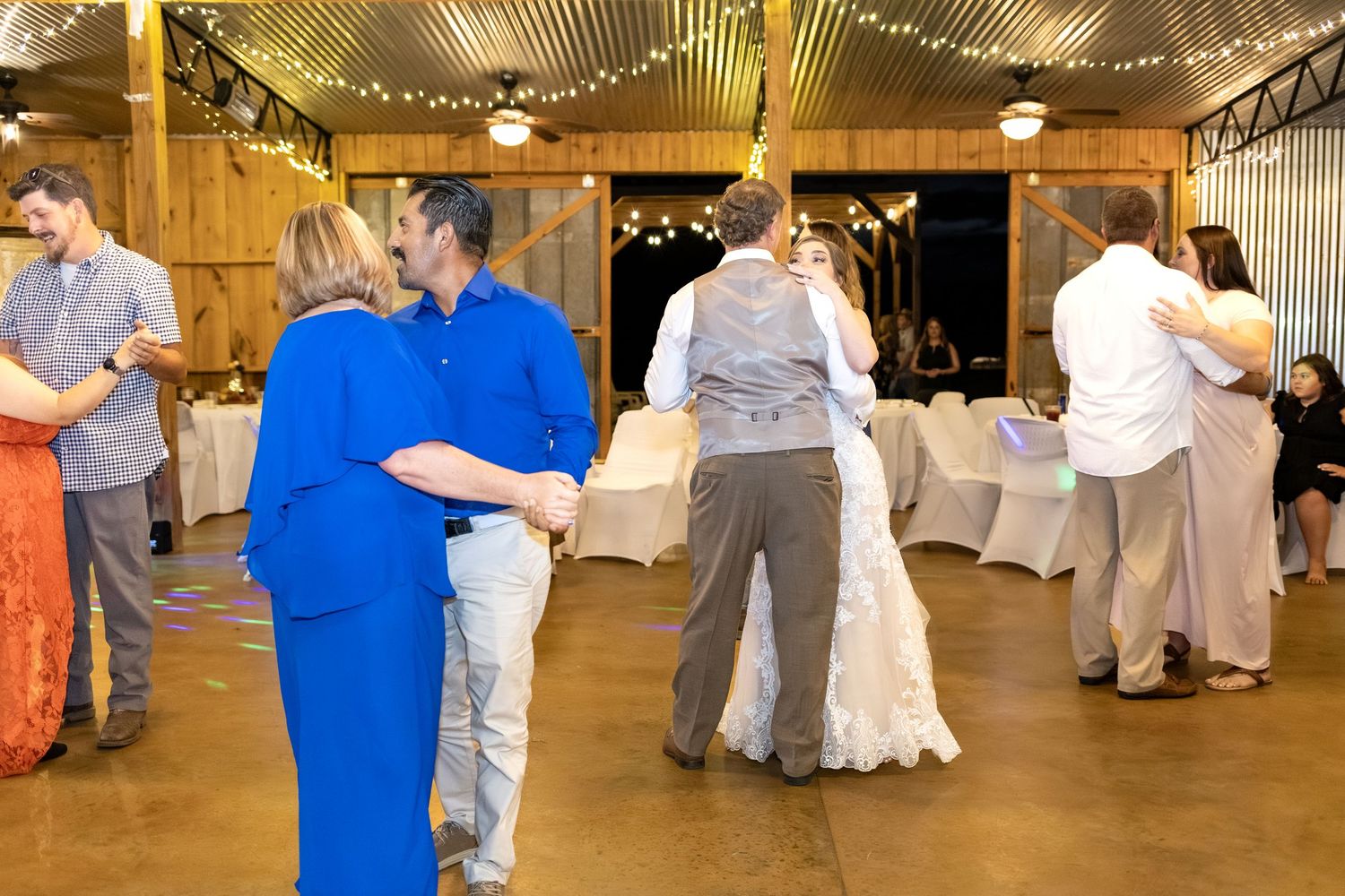 Bride and groom dancing at their wedding in the barn of Hilltop Acres Wicksburg, Alabama