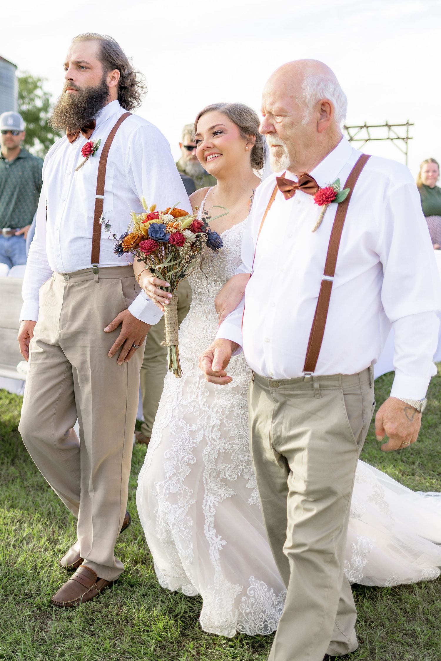 Father and brother giving the bride away at a wedding at Hilltop Acres Wicksburg, Alabama