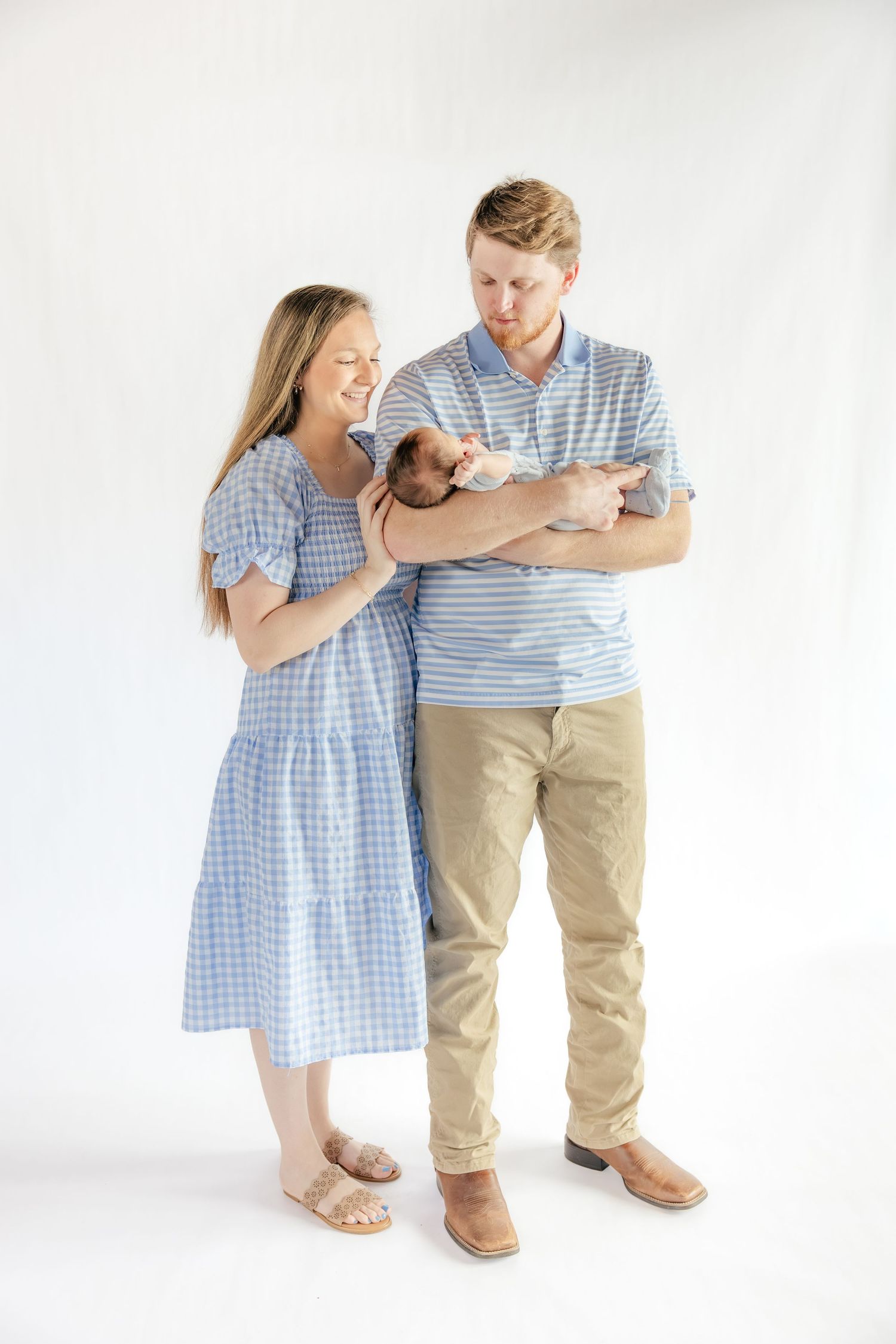 Family holding their baby in a studio in Dothan, Alabama