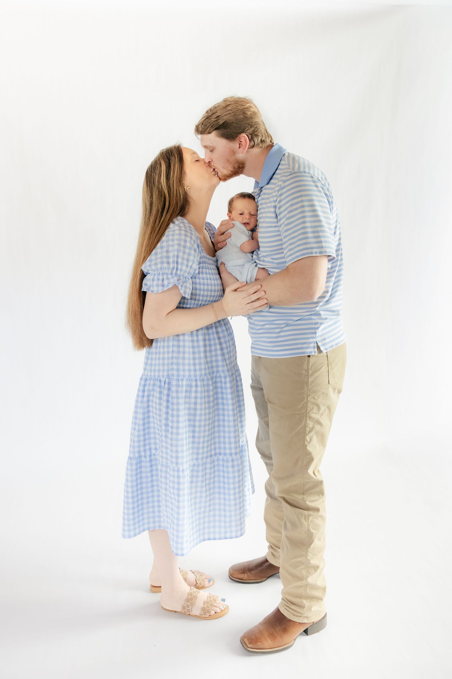 Family holding their baby in a studio in Dothan, Alabama