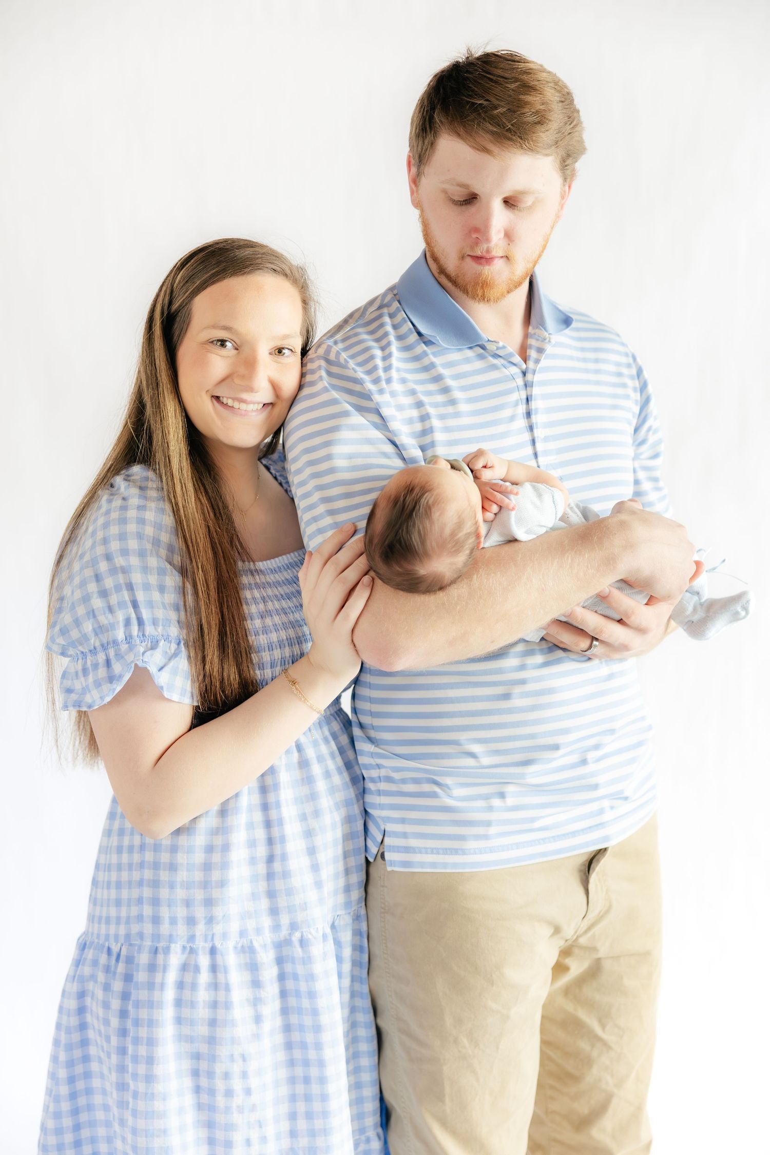 Family holding their baby in a studio in Dothan, Alabama