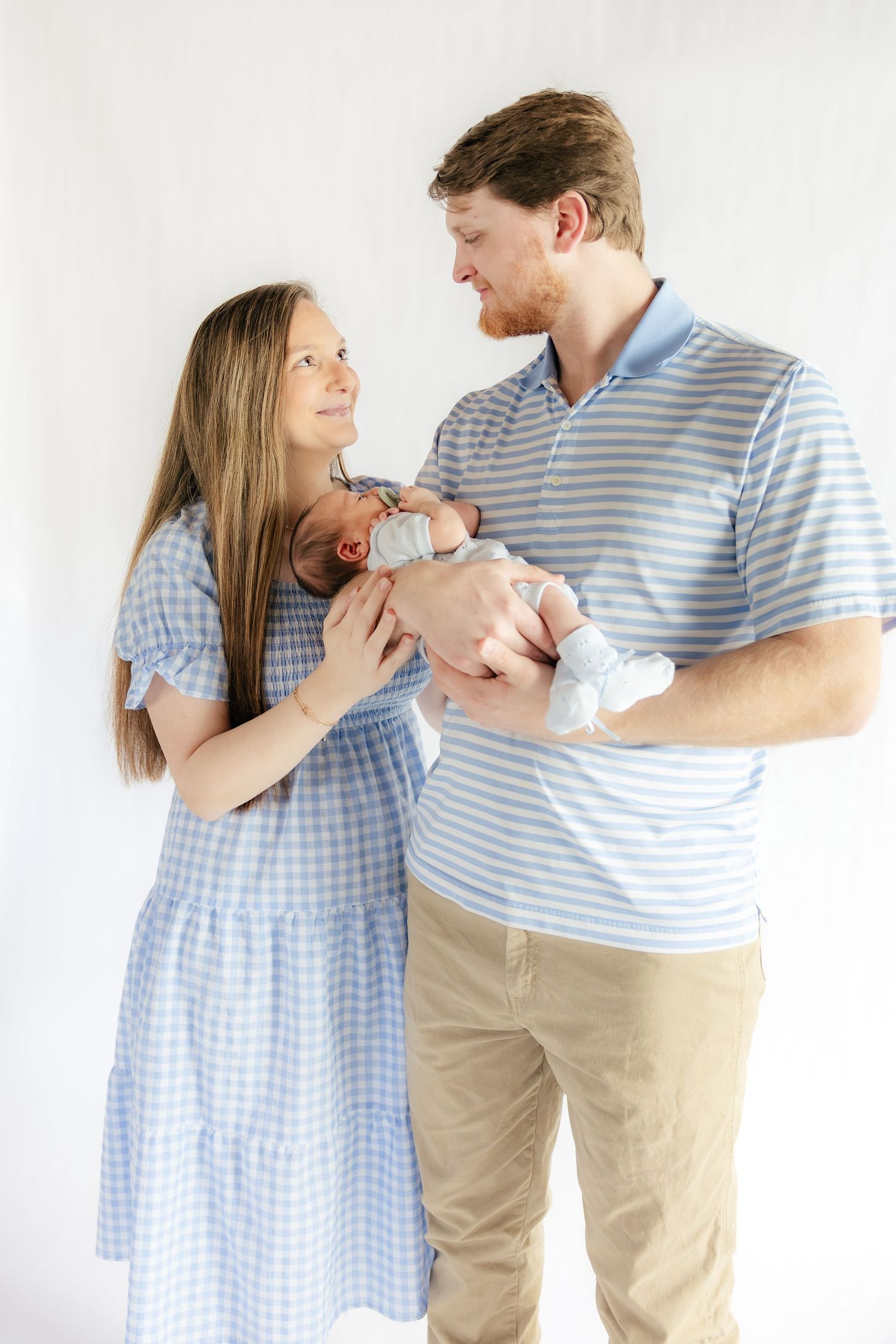 Family holding their baby in a studio in Dothan, Alabama