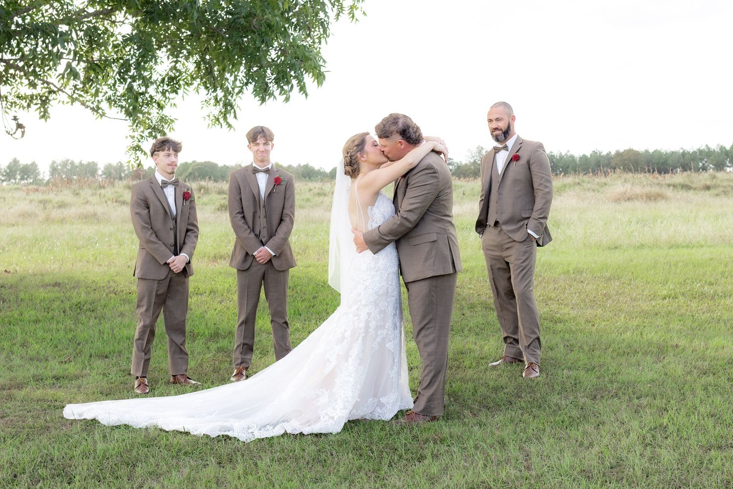 Bridal party posing in a field at sunset at Hilltop Acres Wicksburg, Alabama