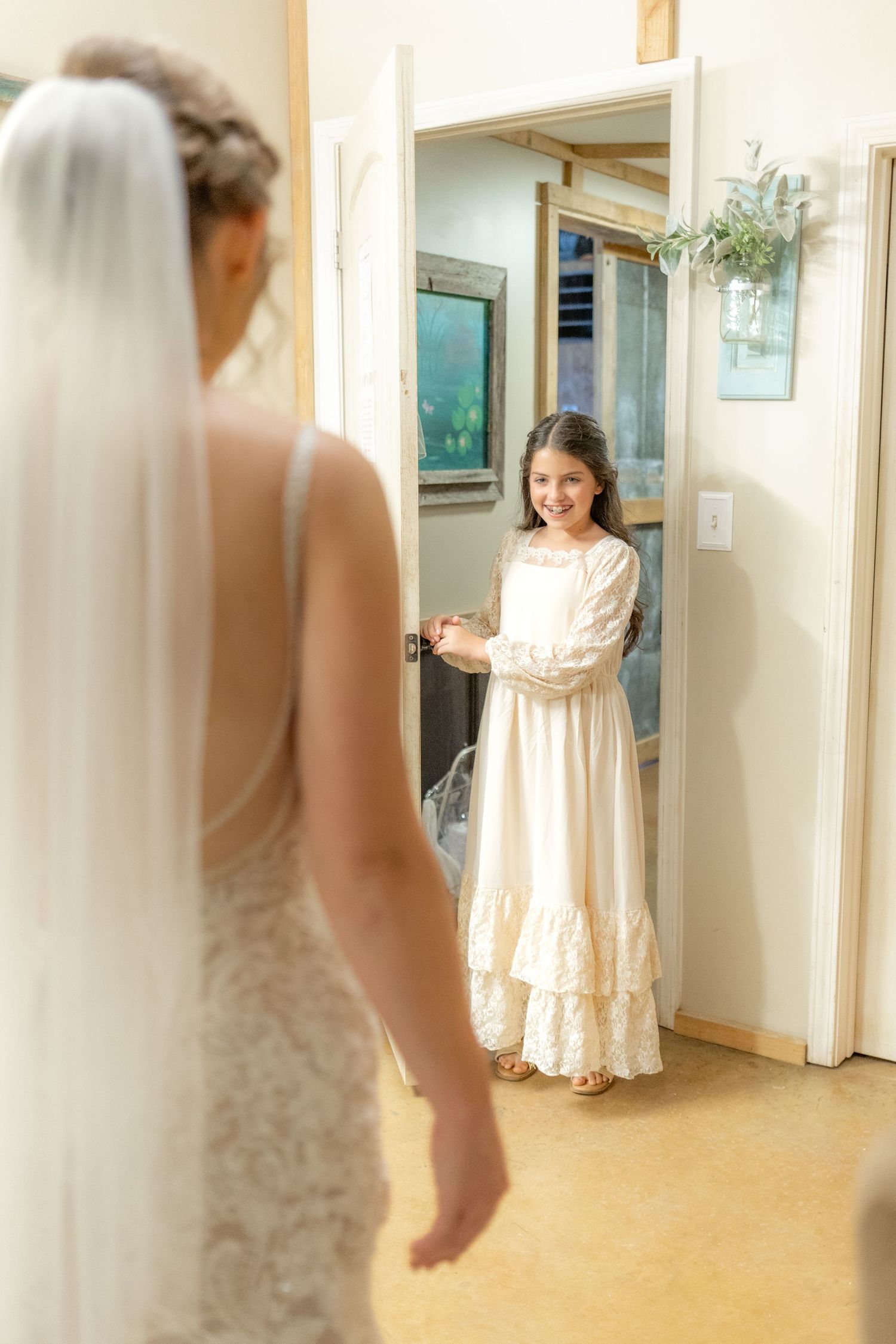 Daughter emotional first look with bride on her wedding day at Hilltop Acres Wicksburg, Alabama