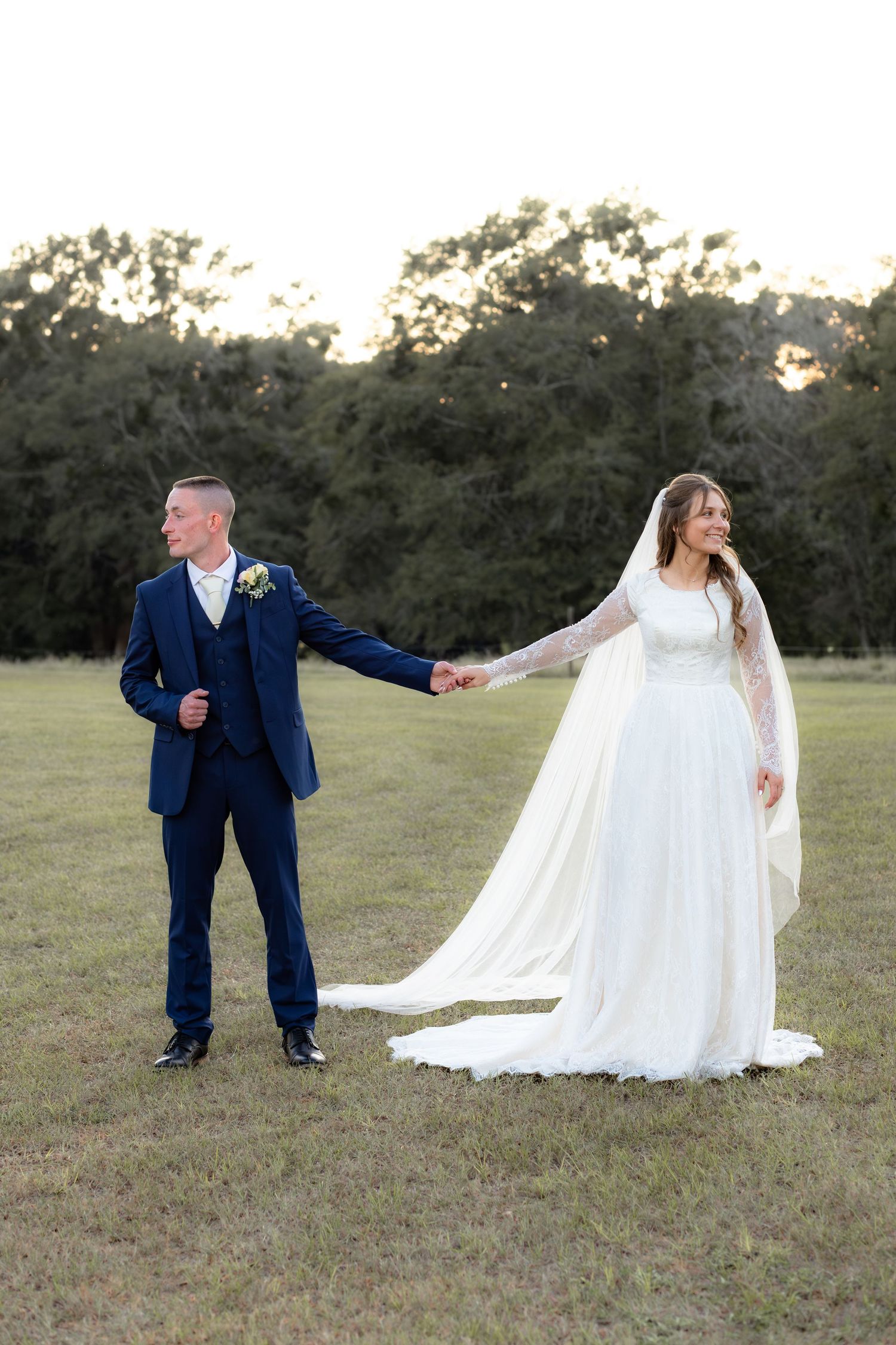 Bride and groom holding hands for portraits at Dalrymple Farms Enterprise, Alabama