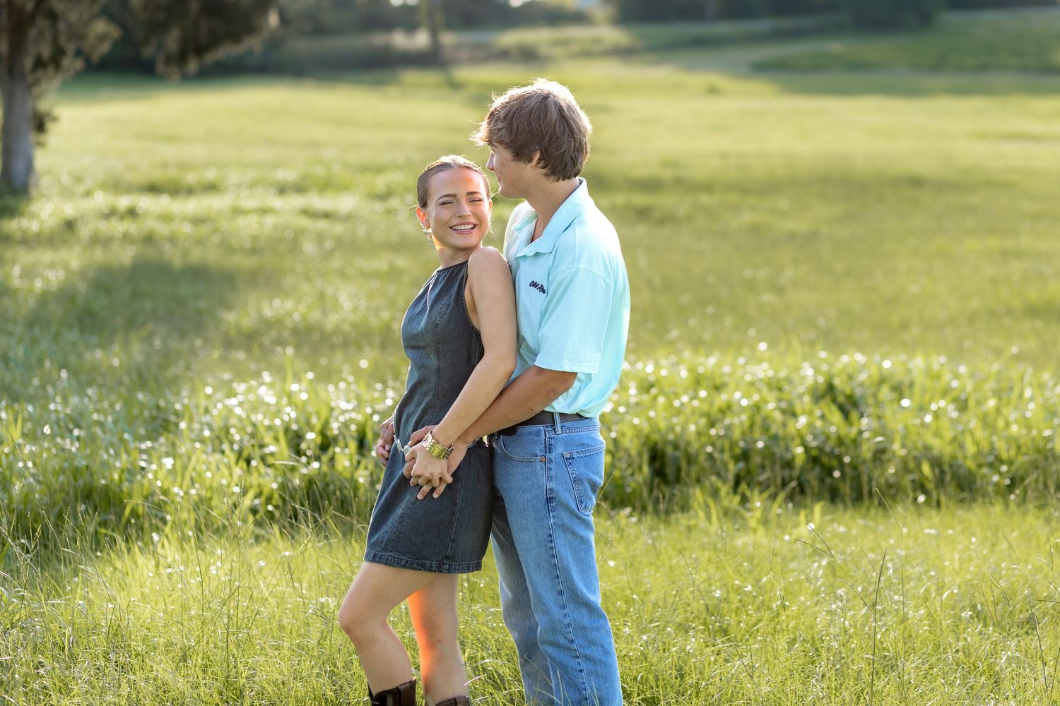 Romantic Couples photos in a tall grass field at sunset near Dothan, Alabama