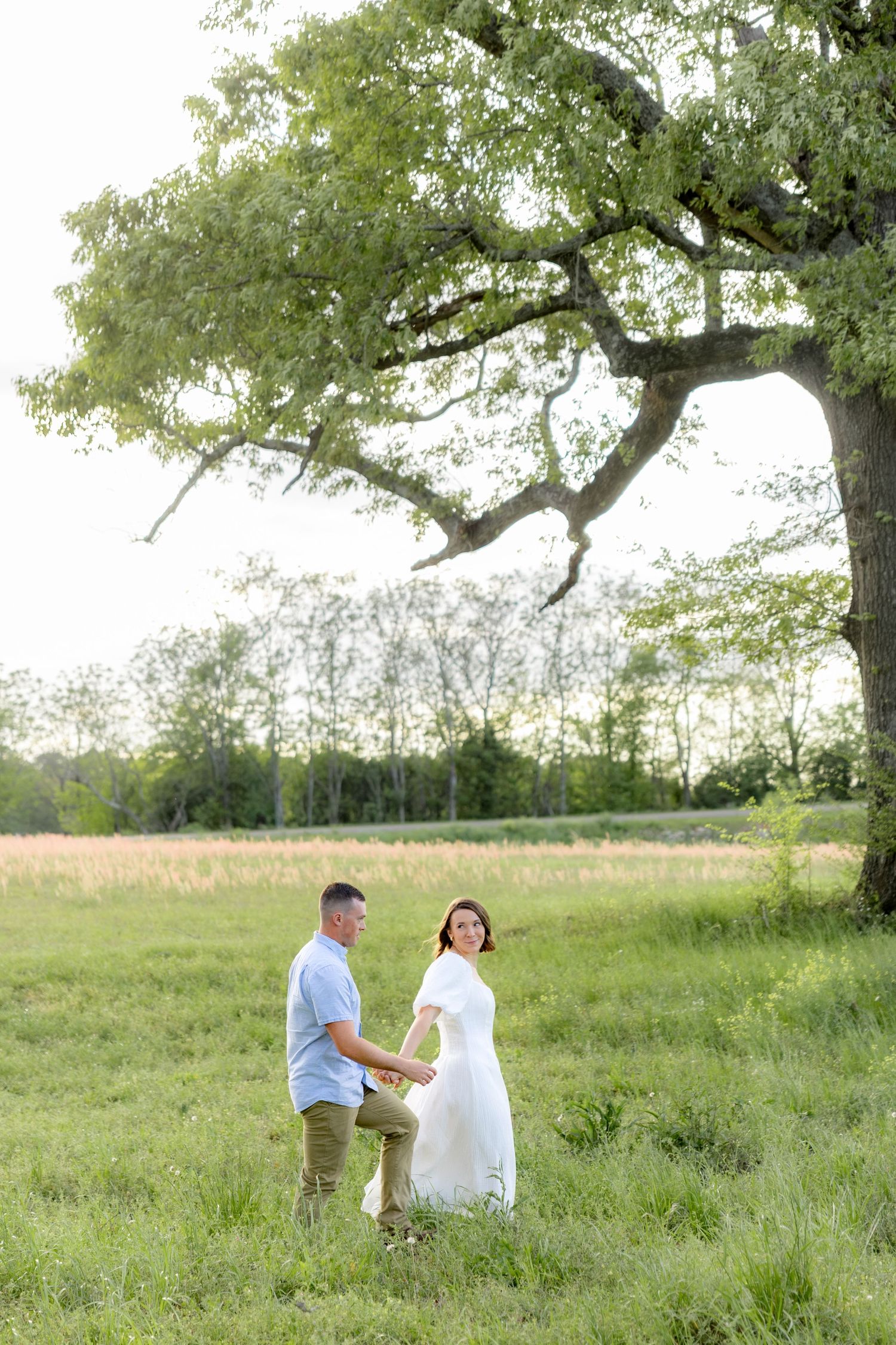 Storytelling romantic couple photos in a tall grass field at sunset in Dothan, Alabama
