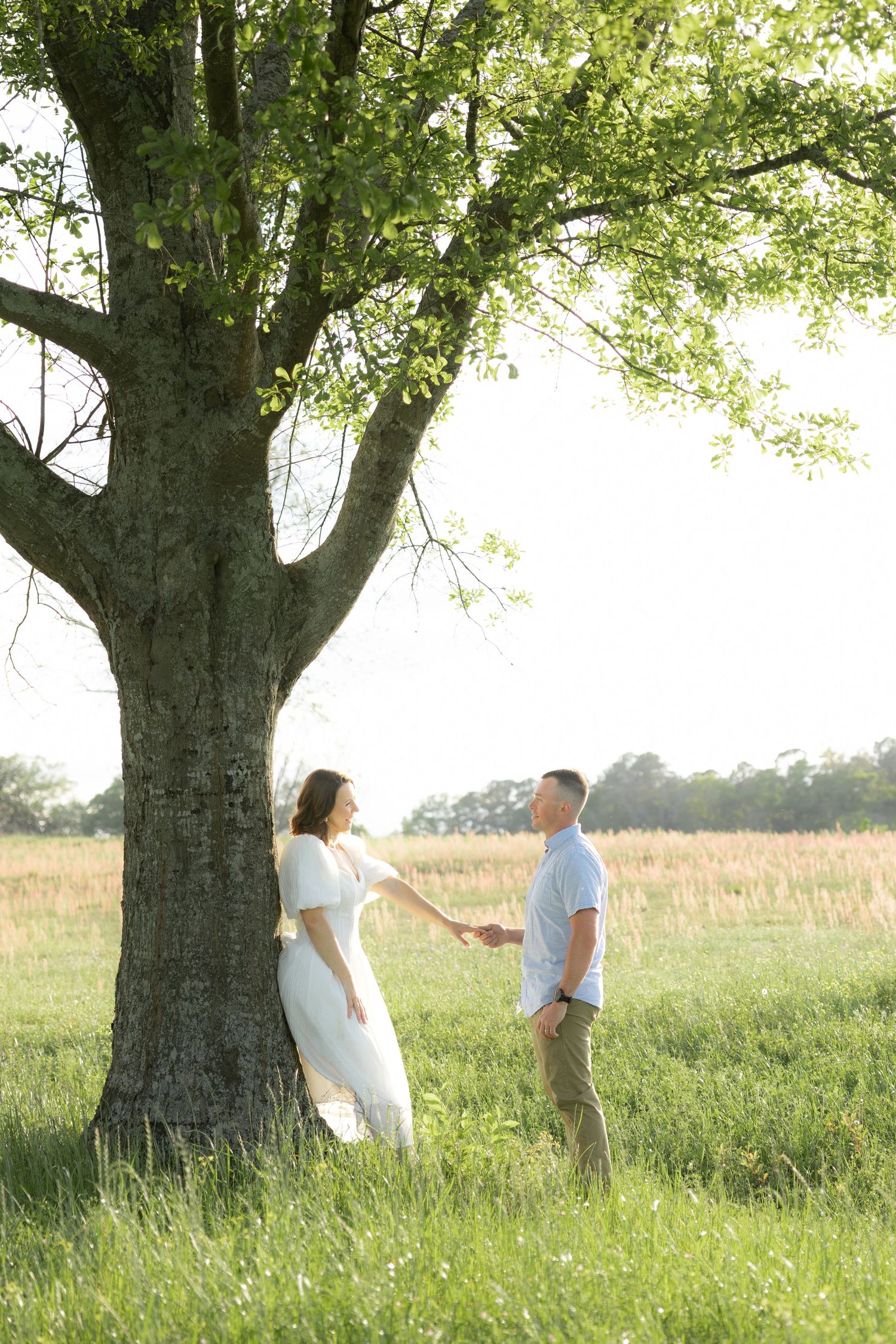 Storytelling romantic couple photos in a tall grass field at sunset in Dothan, Alabama