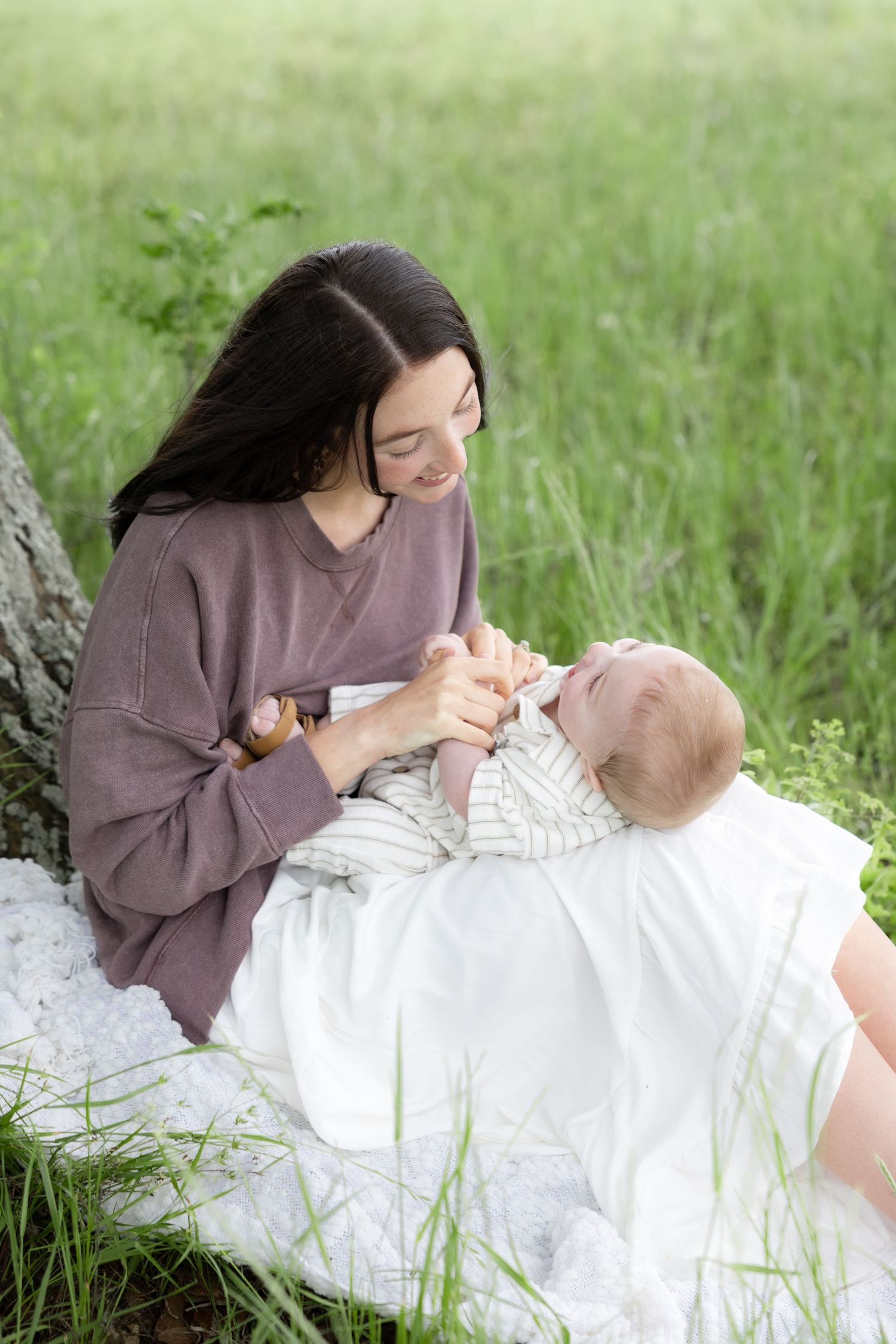 Candid family photos in a grass field | Dothan, Alabama Lifestyle Portrait Photographer