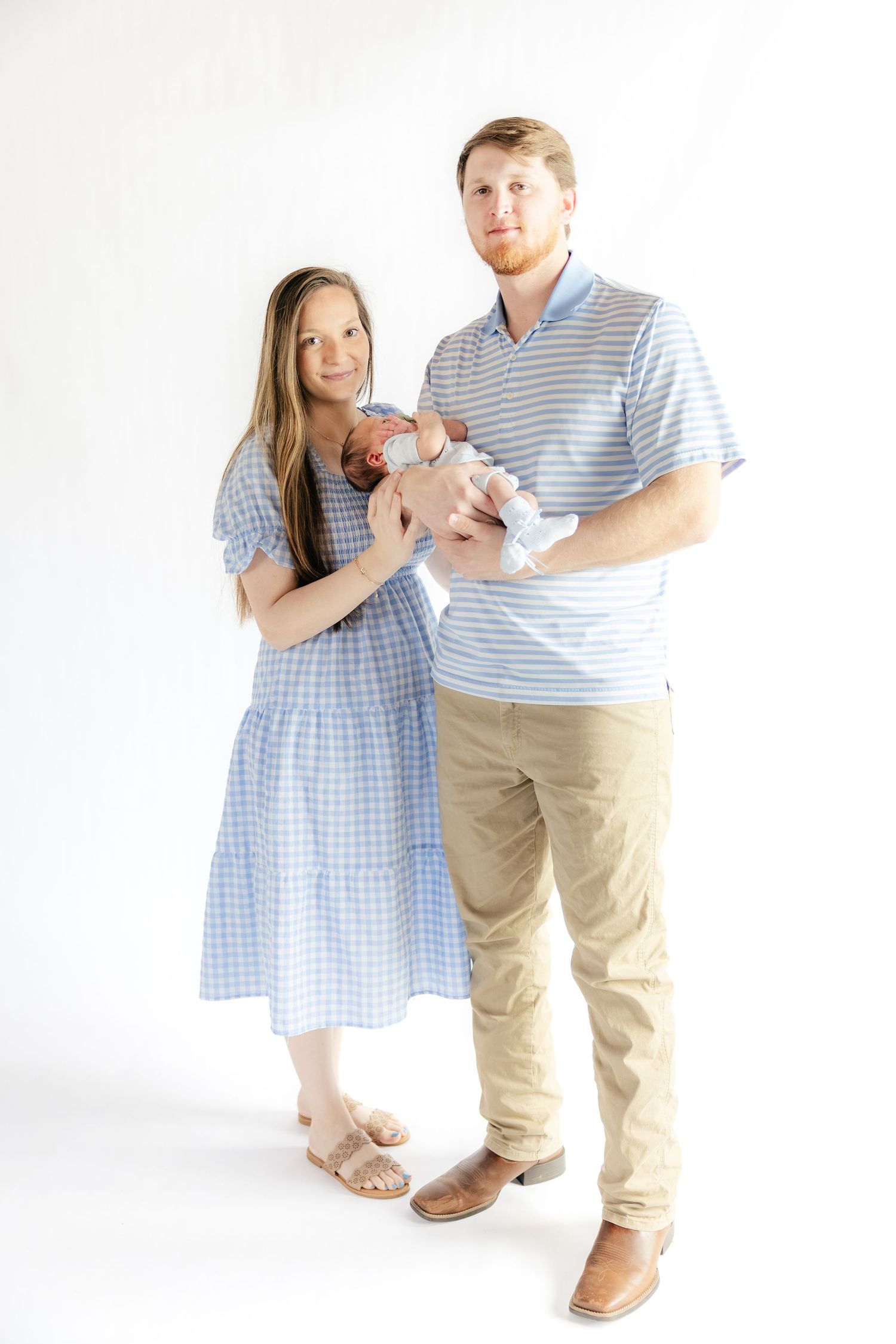 Family holding their baby in a studio in Dothan, Alabama