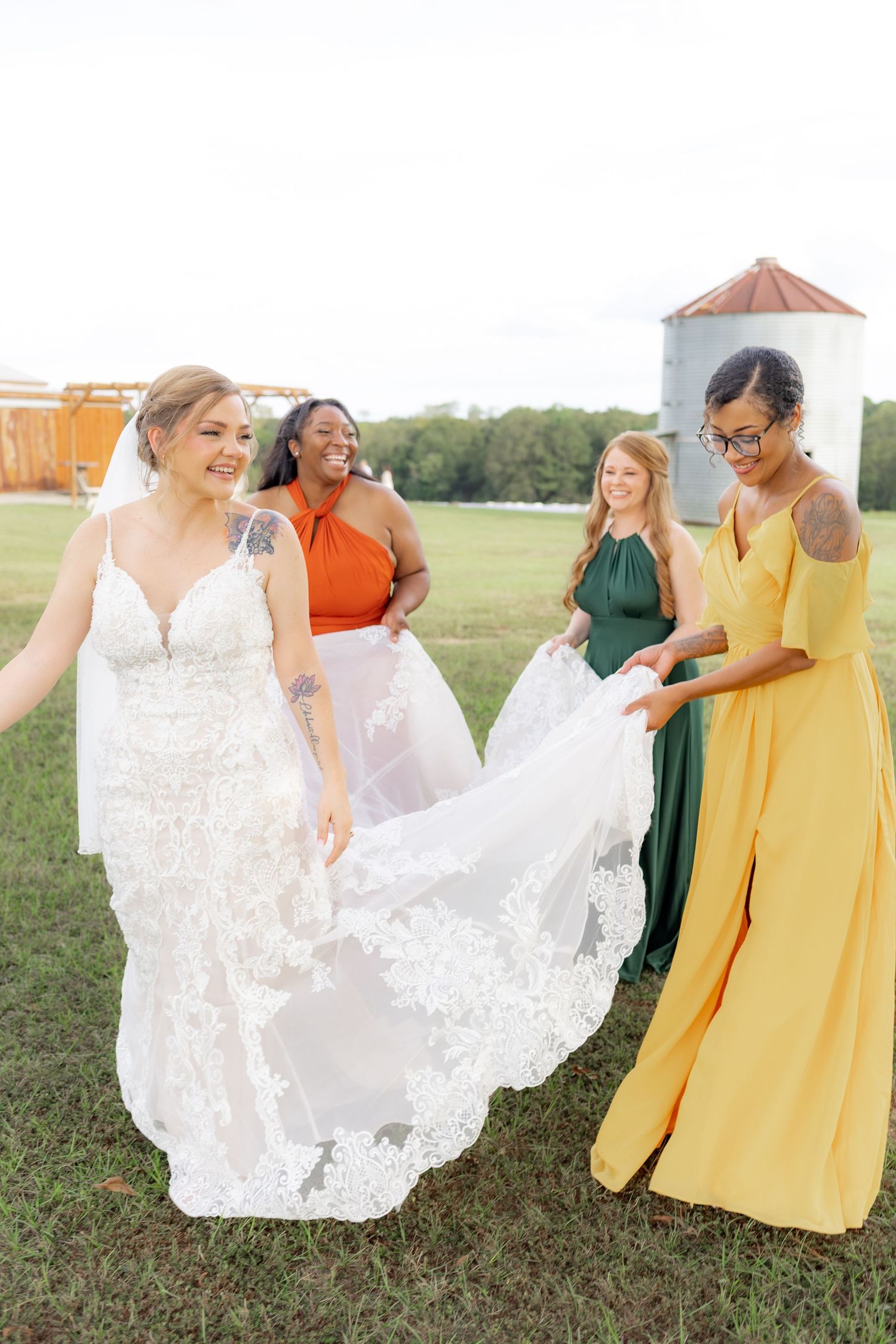 Bridal party posing in a field at sunset at Hilltop Acres Wicksburg, Alabama