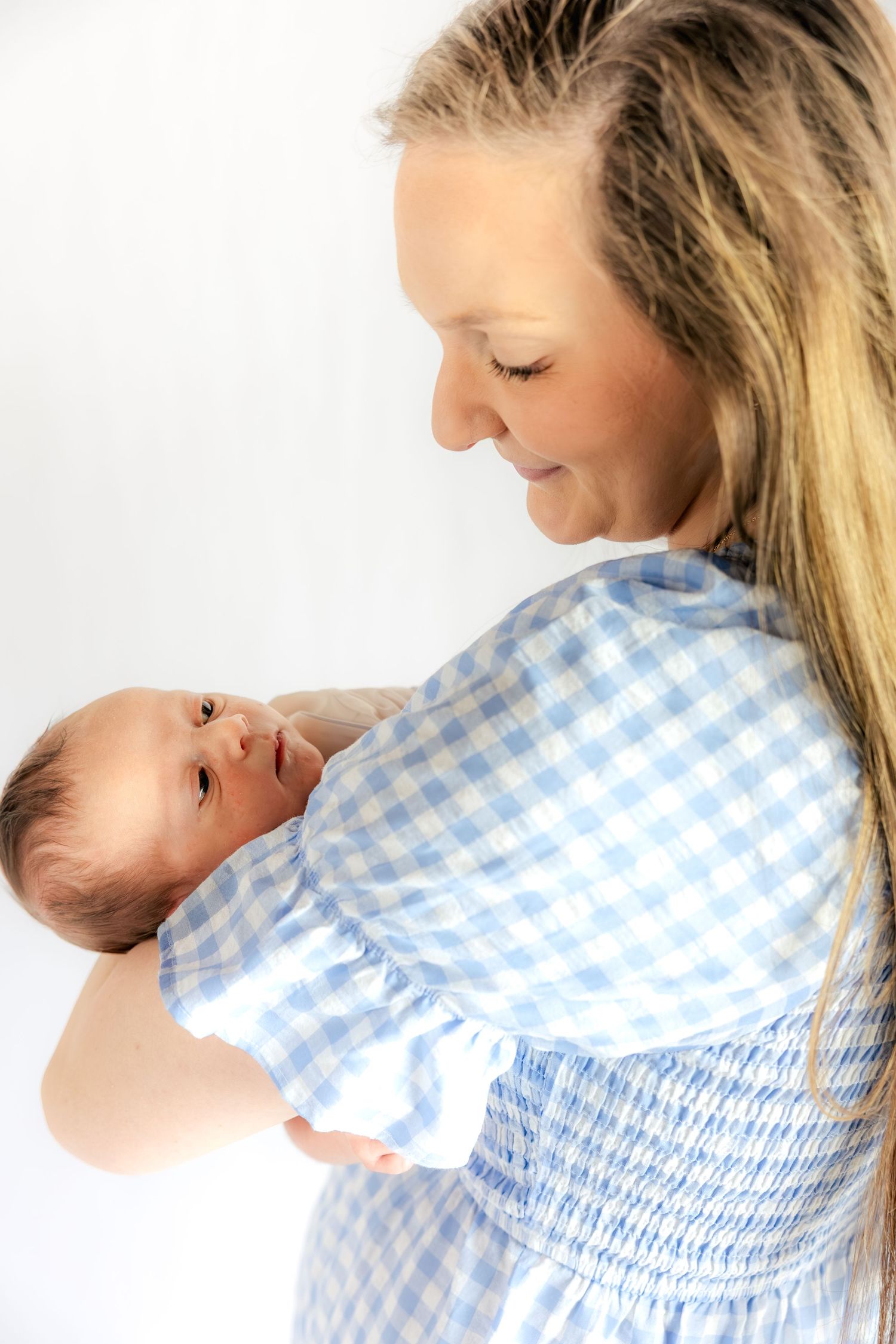Mother holding her baby in a studio in Dothan, Alabama