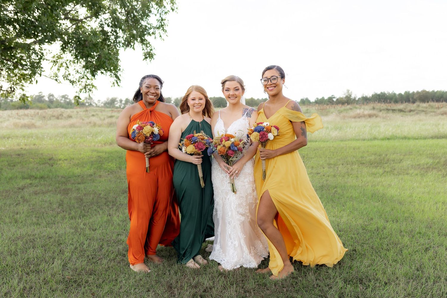 Bridal party posing in a field at sunset at Hilltop Acres Wicksburg, Alabama