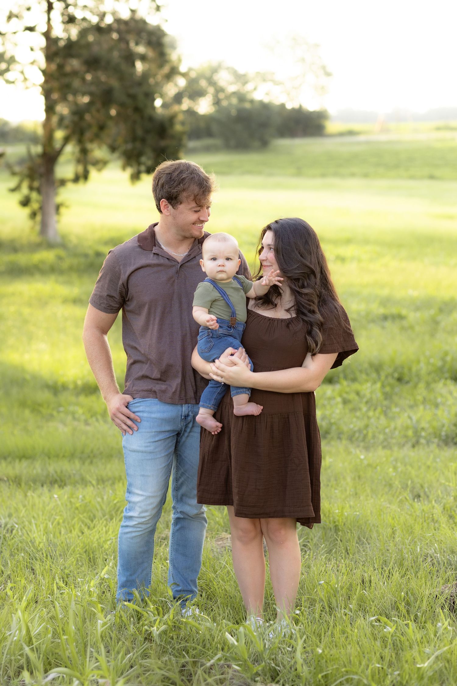 Family Pictures in a grass field at sunset near Dothan, Alabama