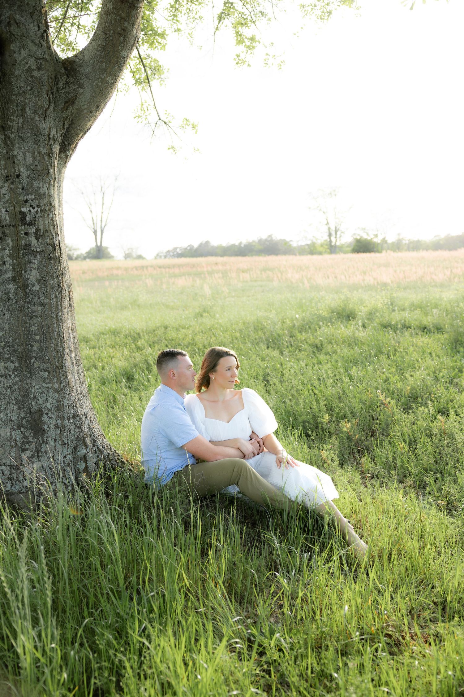 Storytelling romantic couple photos in a tall grass field at sunset in Dothan, Alabama