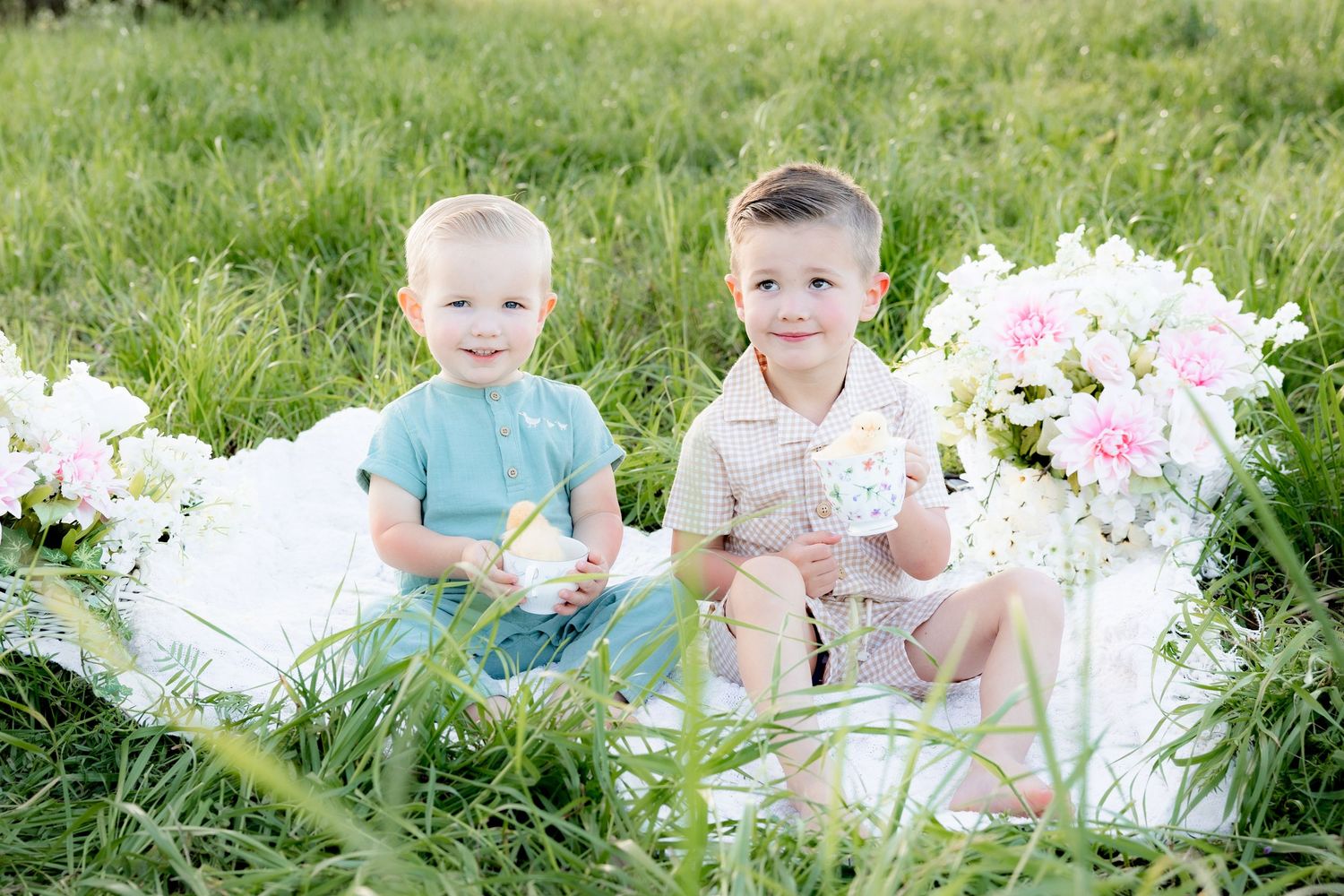 Spring Mini Session with baby chicks in a grass field at sunset near Dothan, Alabama