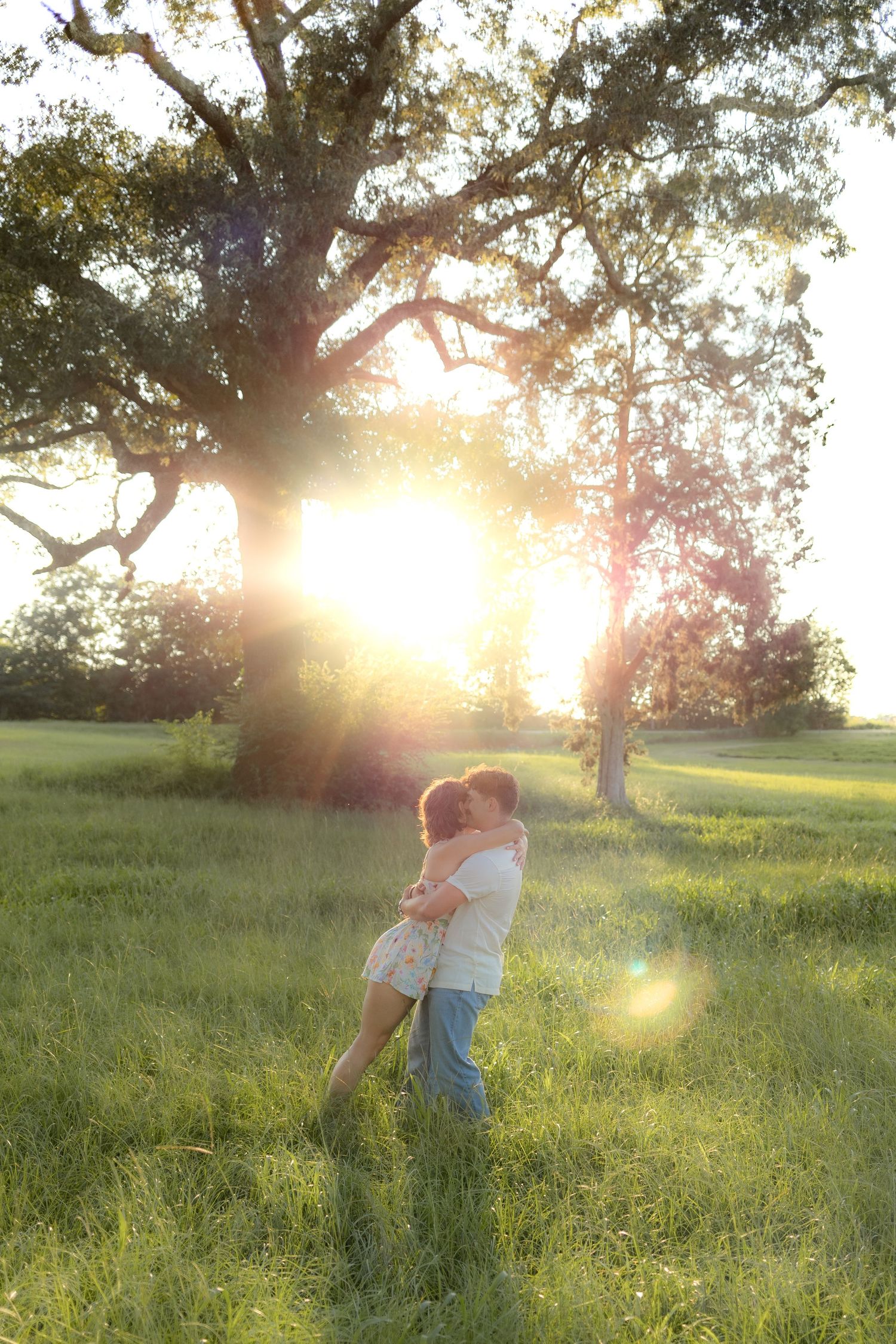 Romantic Couples photos in a tall grass field at sunset near Dothan, Alabama