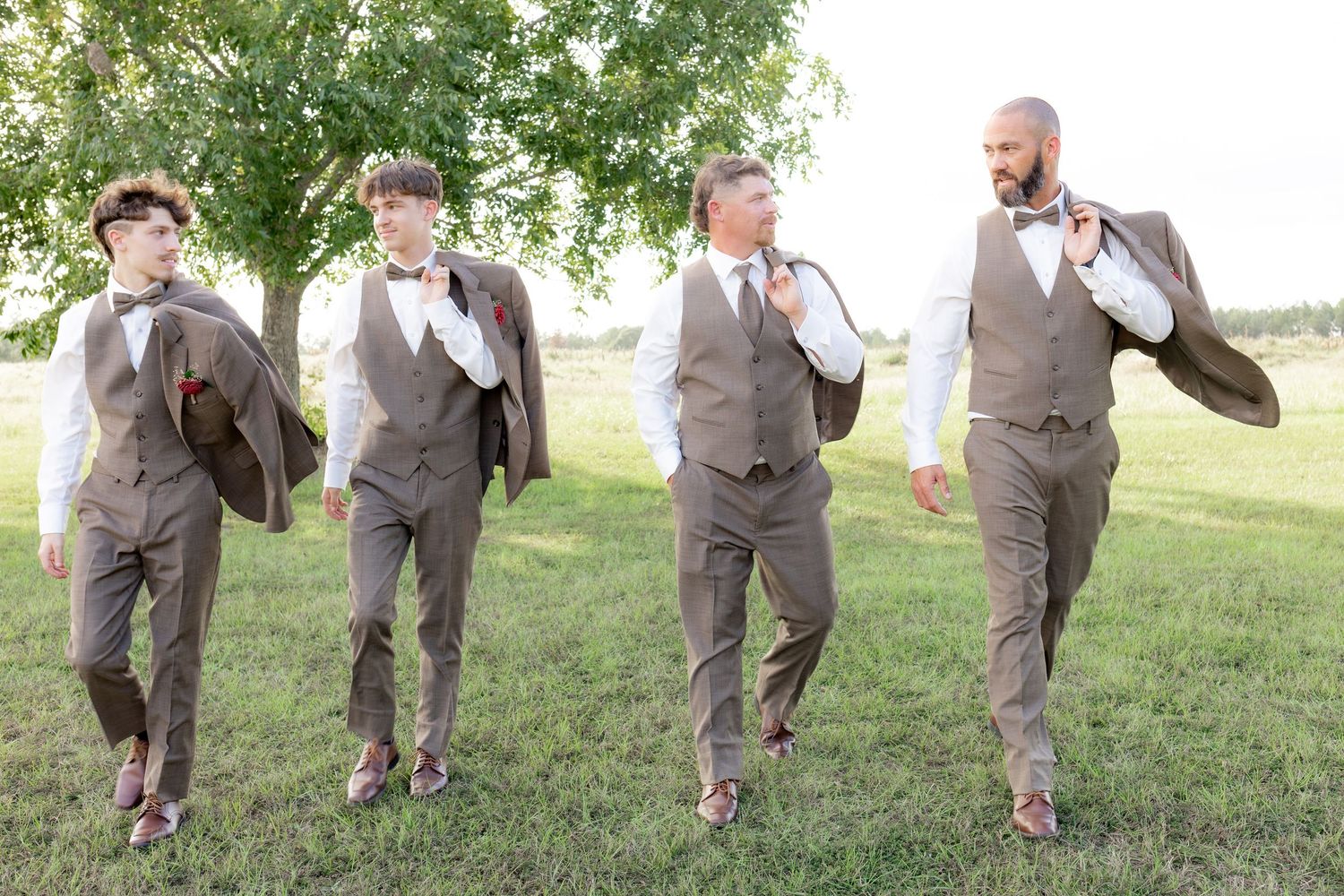 Bridal party posing in a field at sunset at Hilltop Acres Wicksburg, Alabama
