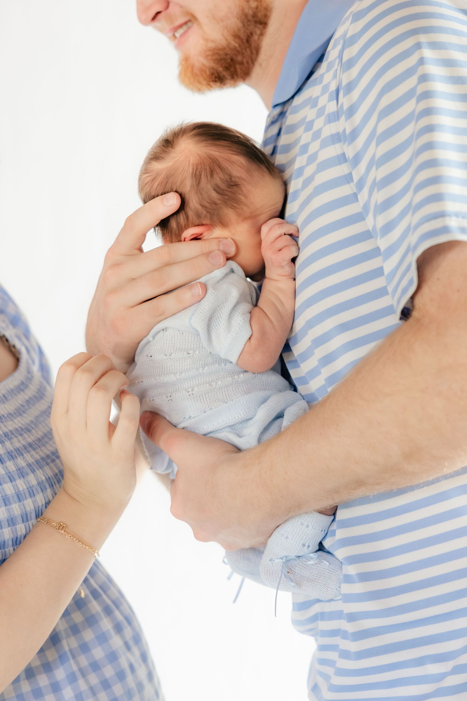 Family holding their baby in a studio in Dothan, Alabama