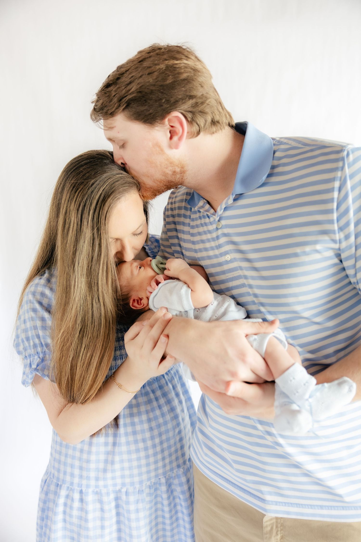 Family holding their baby in a studio in Dothan, Alabama