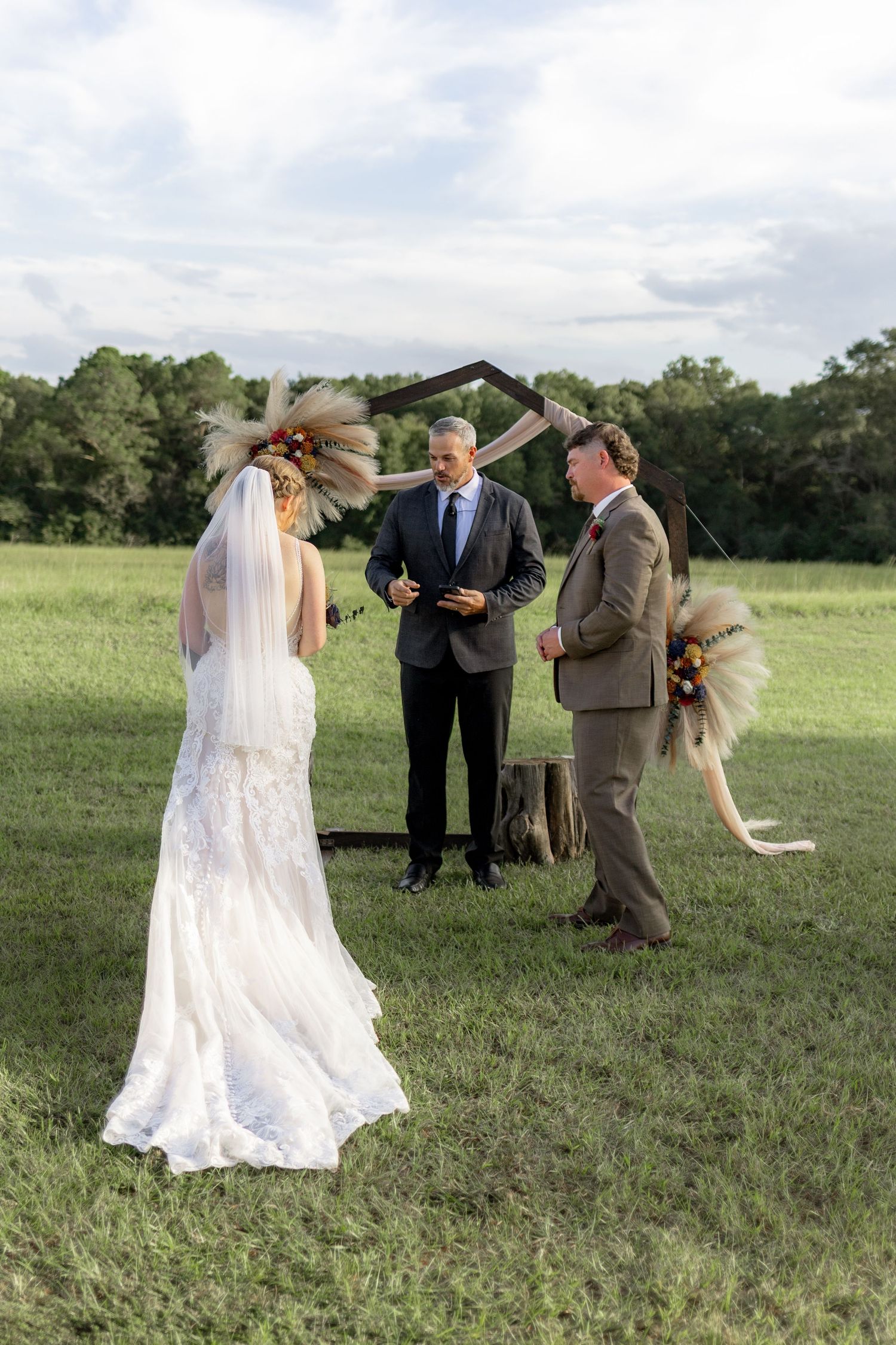 Bride and groom at the altar at their wedding at Hilltop Acres Wicksburg, Alabama