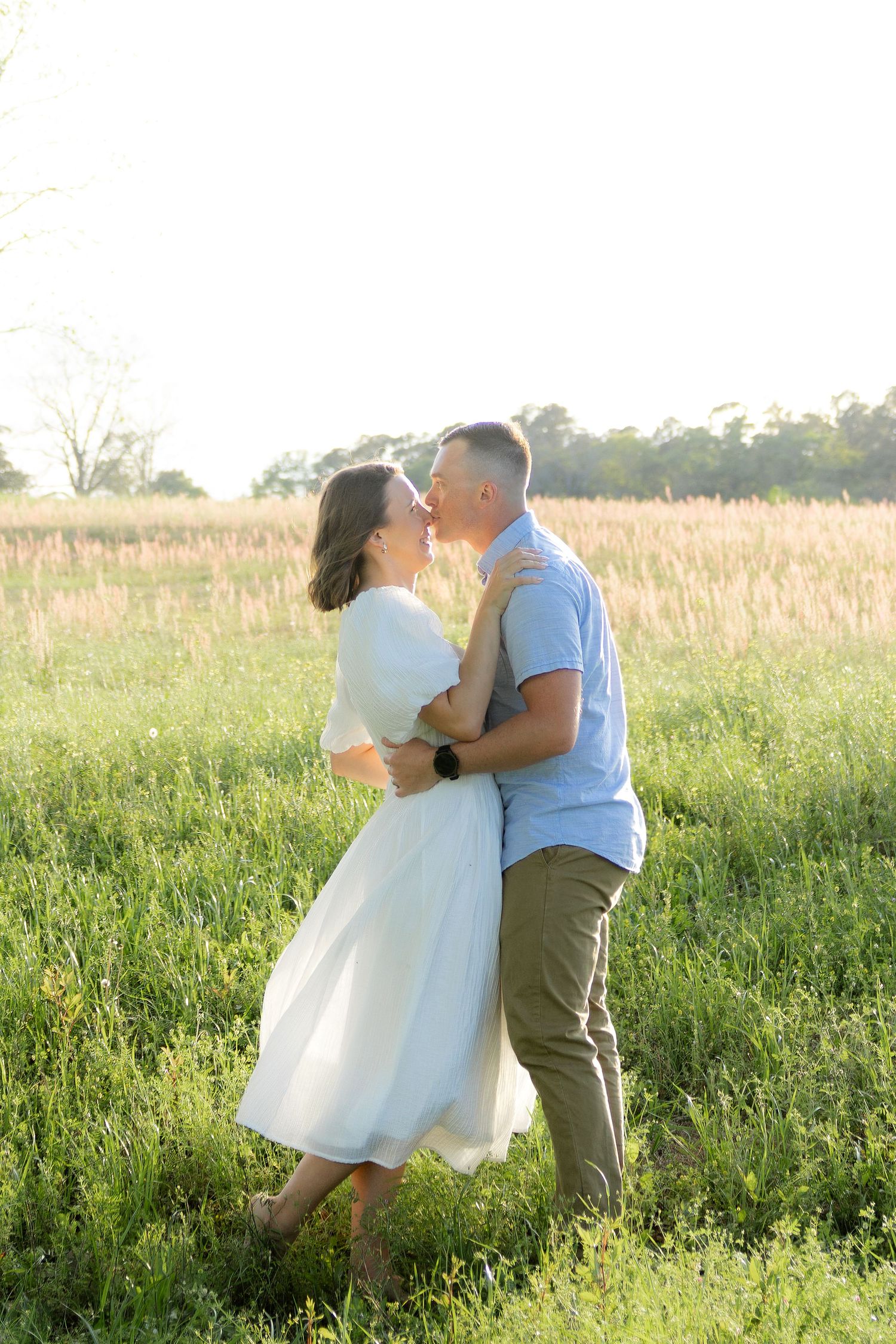 Storytelling couple photos in a tall grass field at sunset in Dothan, Alabama